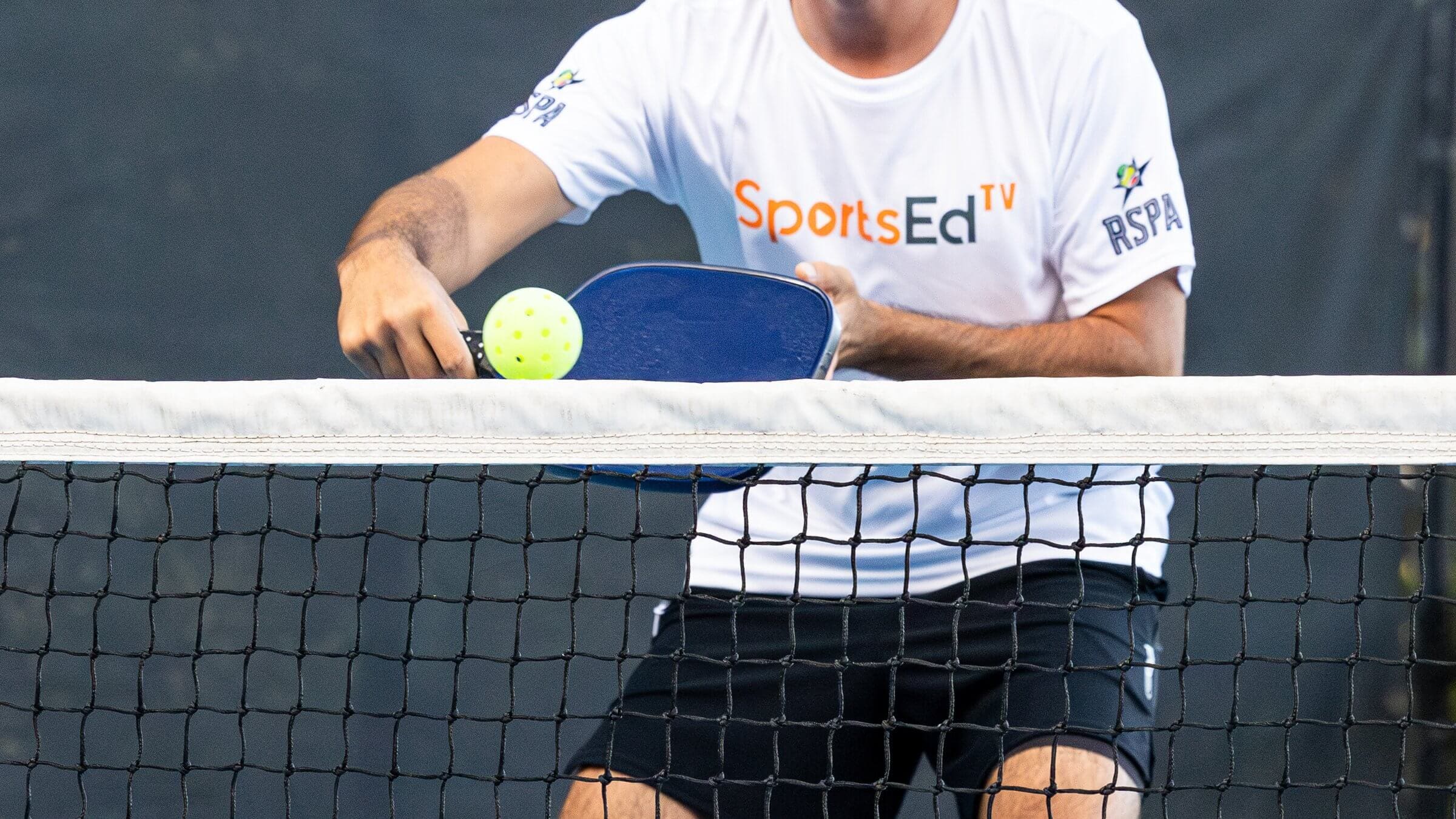 Pickleball player returning a shot