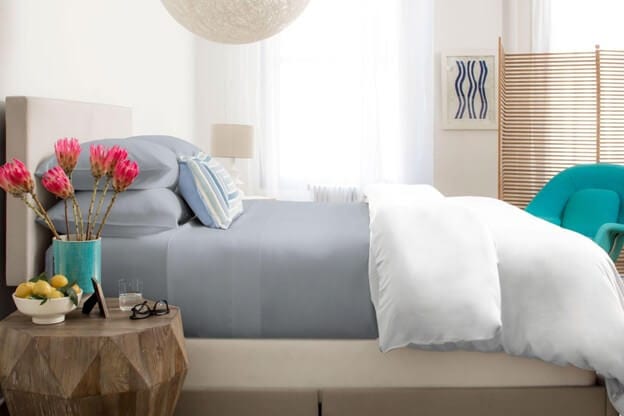 A Made Bed With SHEEX Cooling Sheets & Pillowcases