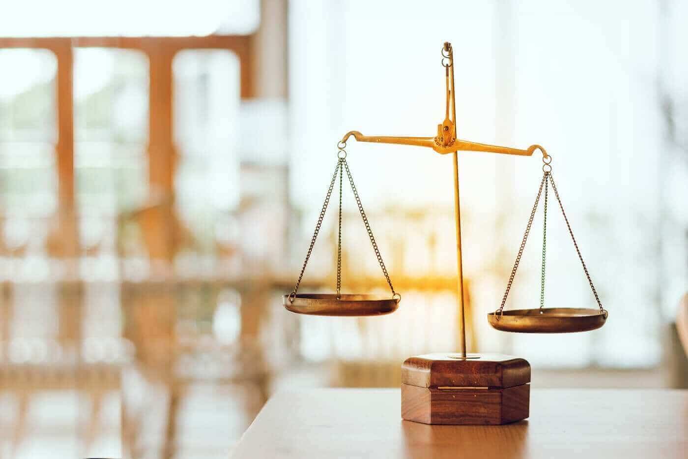 Brass scales of justice, representing balanced and defensible forensic support for attorneys