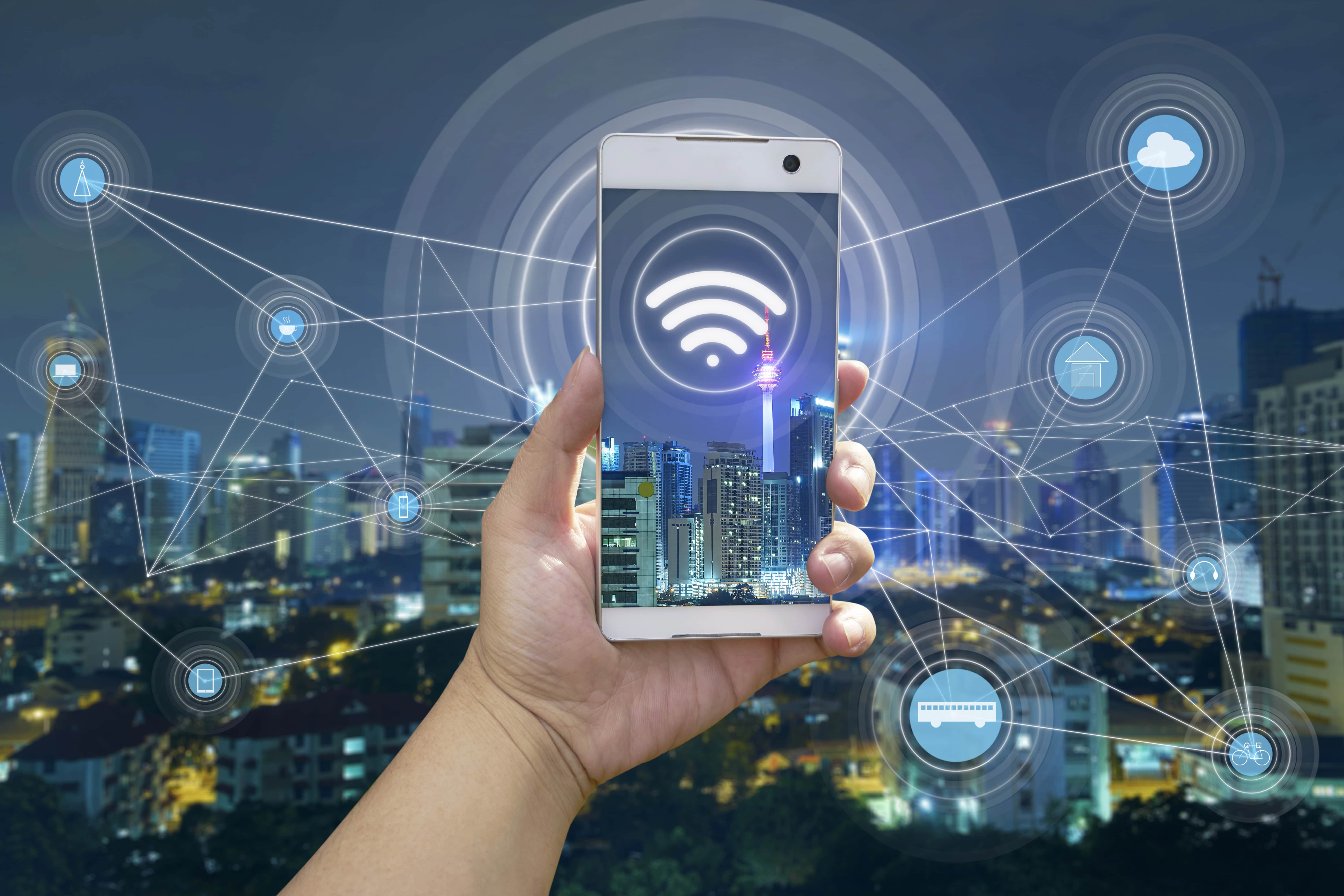 IT manager reviewing a business Wi-Fi network upgrade comparing Wi-Fi 6E and Wi-Fi 7