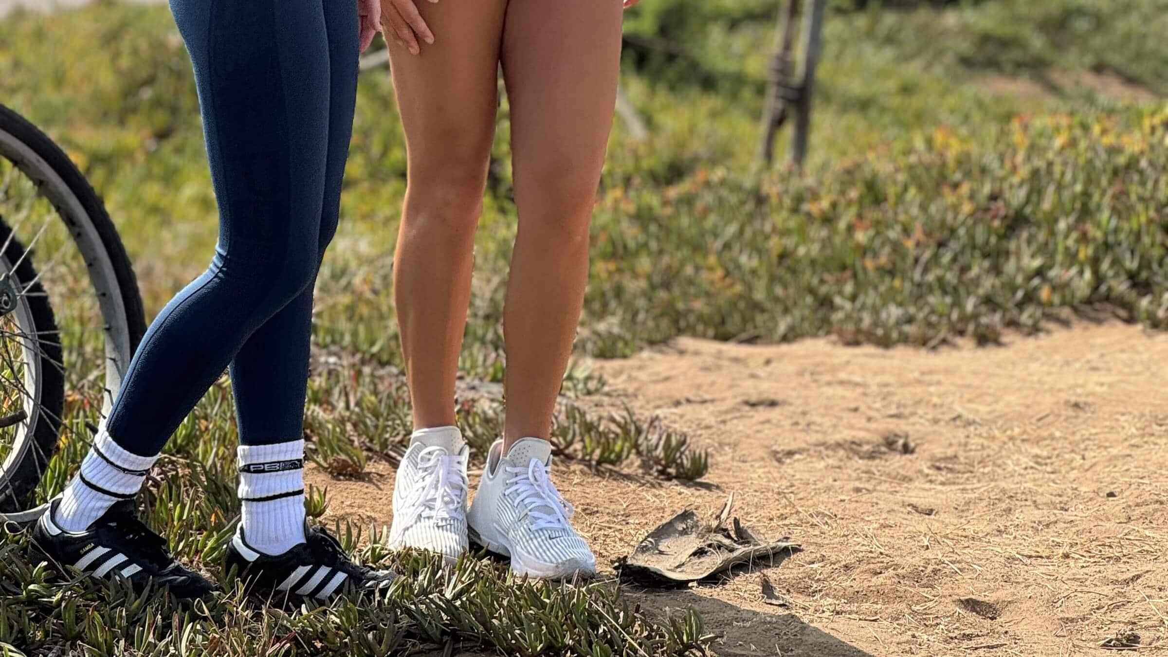 Two women standing on a field