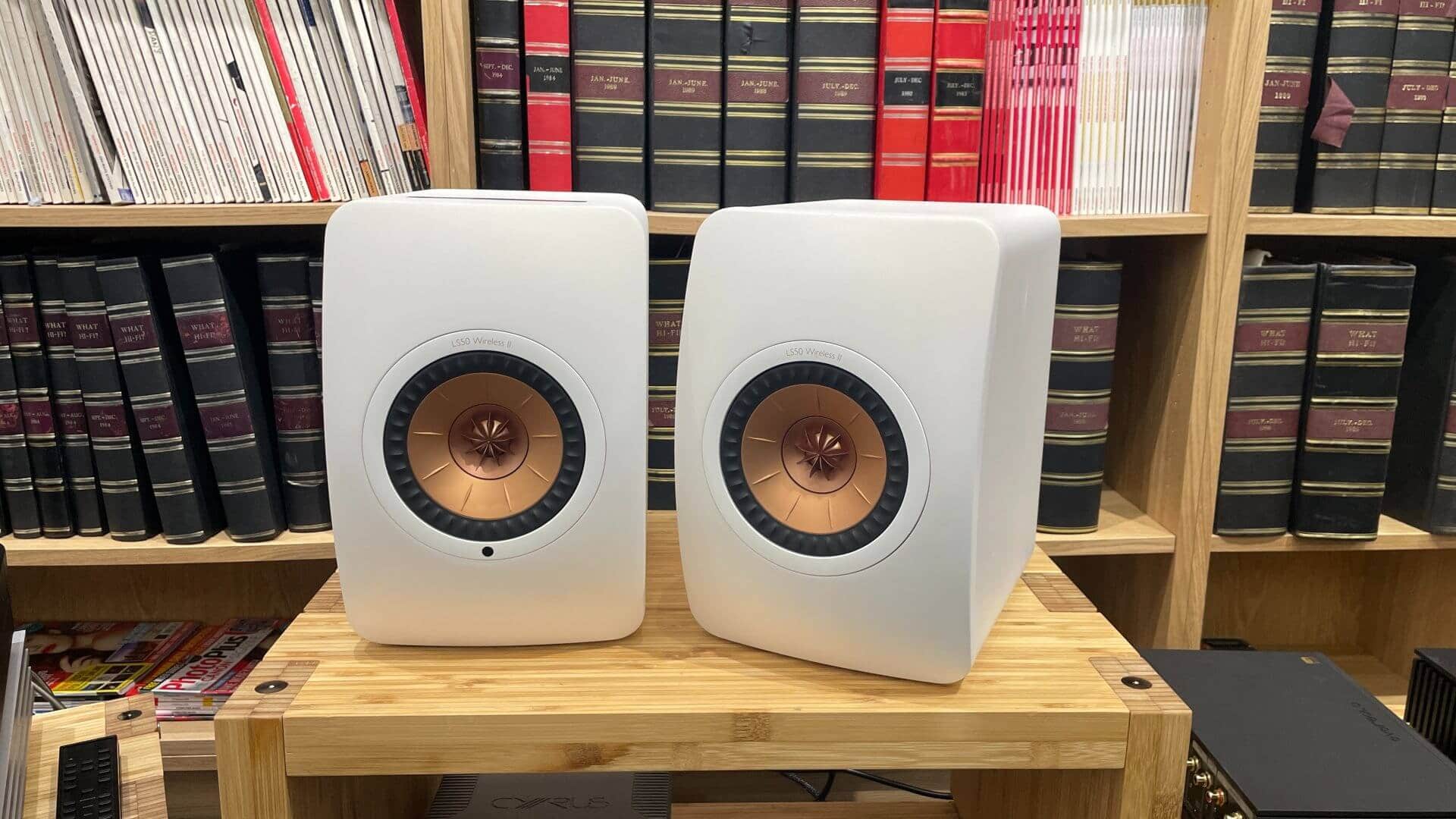 KEF LS50 Wireless II in White Finish on Wooden Rack