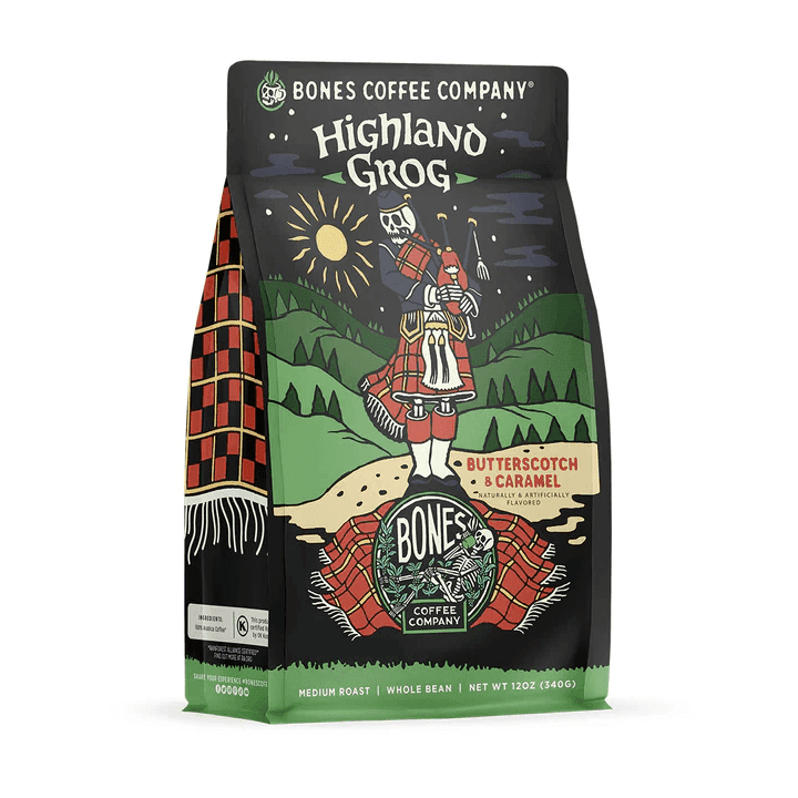 Bones Coffee Highland Grog bag with butterscotch caramel flavor, surrounded by coffee beans, caramel pieces, and a cup.