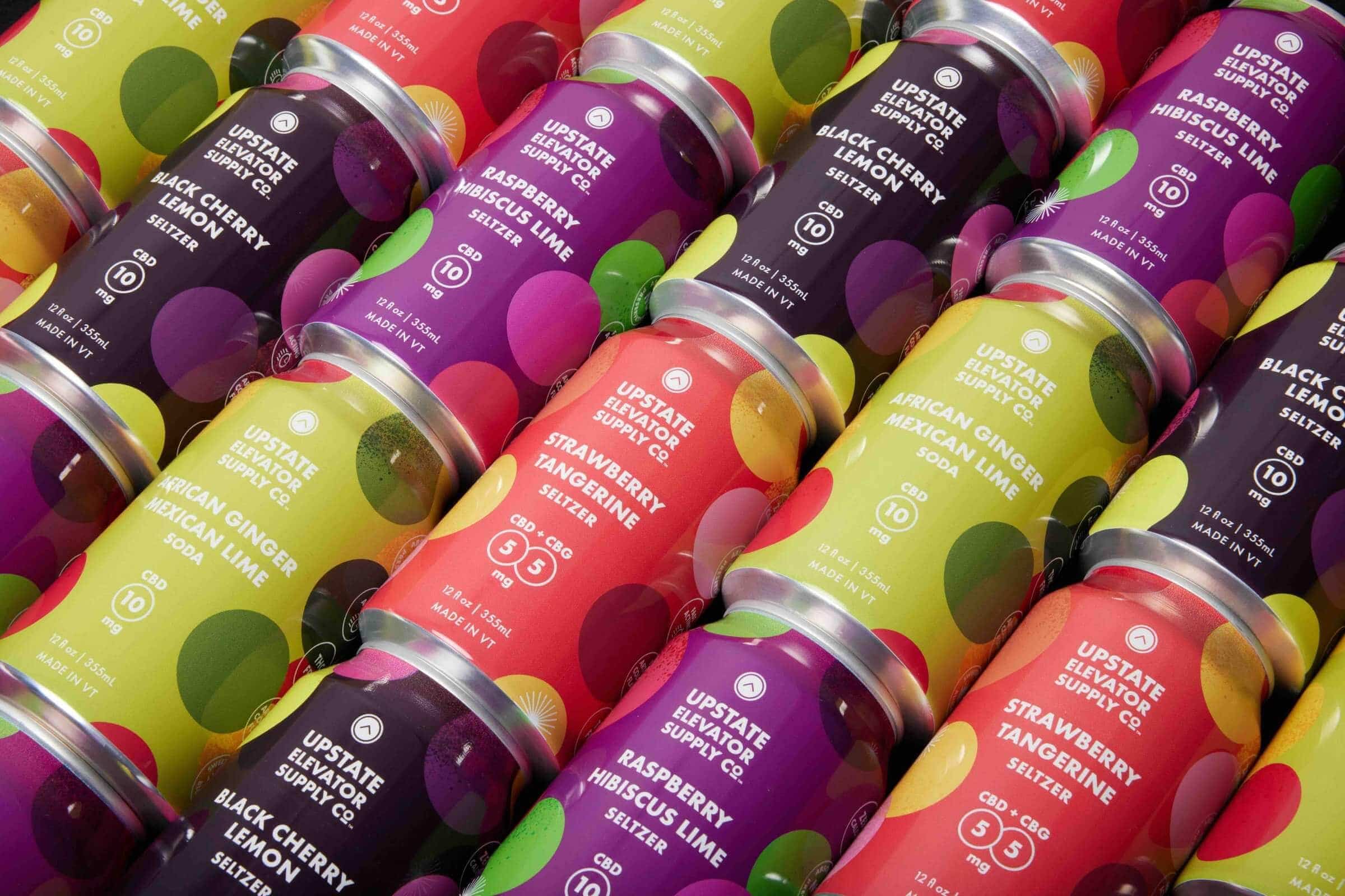 Rows of Upstate Elevator seltzer and soda cans in four flavors, including Strawberry Tangerine and Black Cherry Lemon