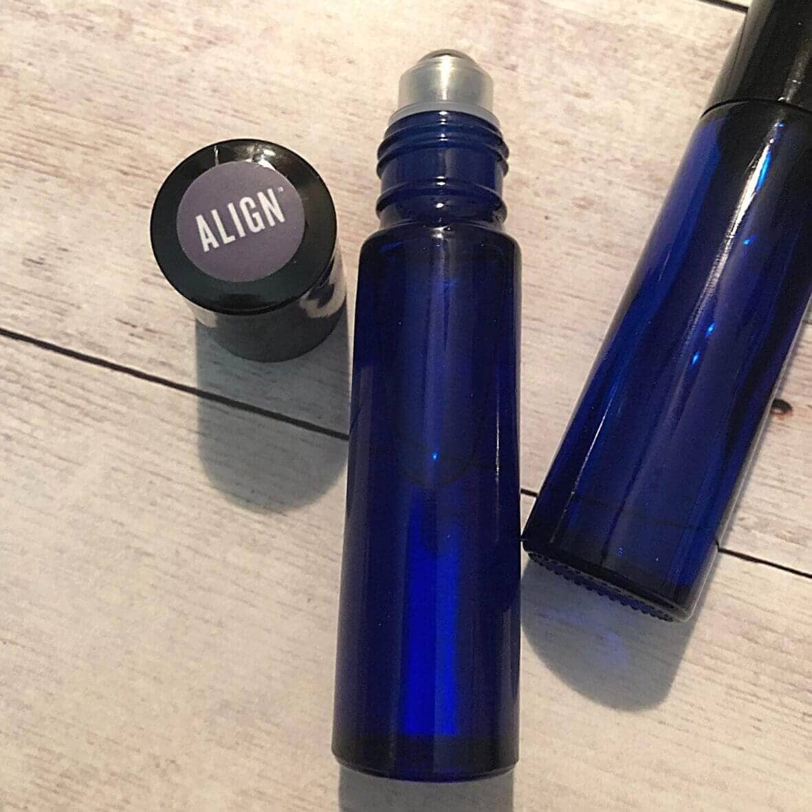 Essential oil roller blend in a blue glass roller bottle
