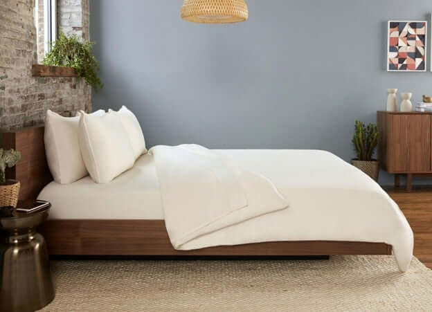 A Guest Bedroom Bed With Temperature Regulating Sheets by SHEEX