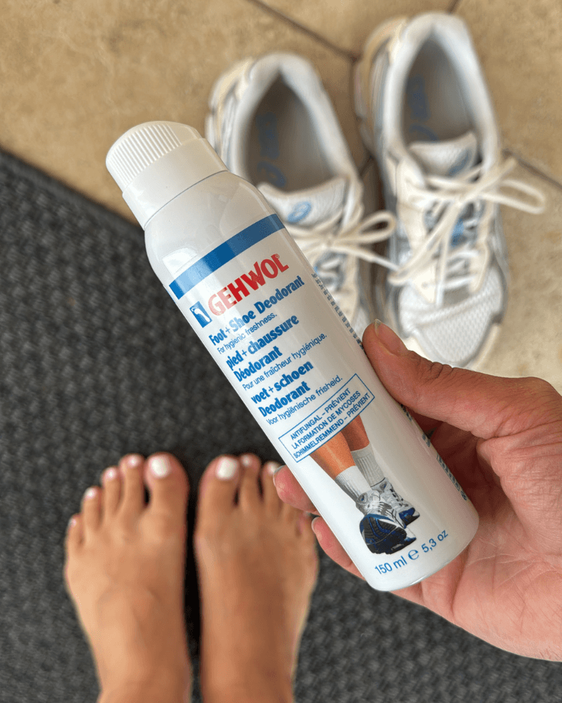 how to keep shoes fresh - GEHWOL foot deodorant spray next to feet and shoes