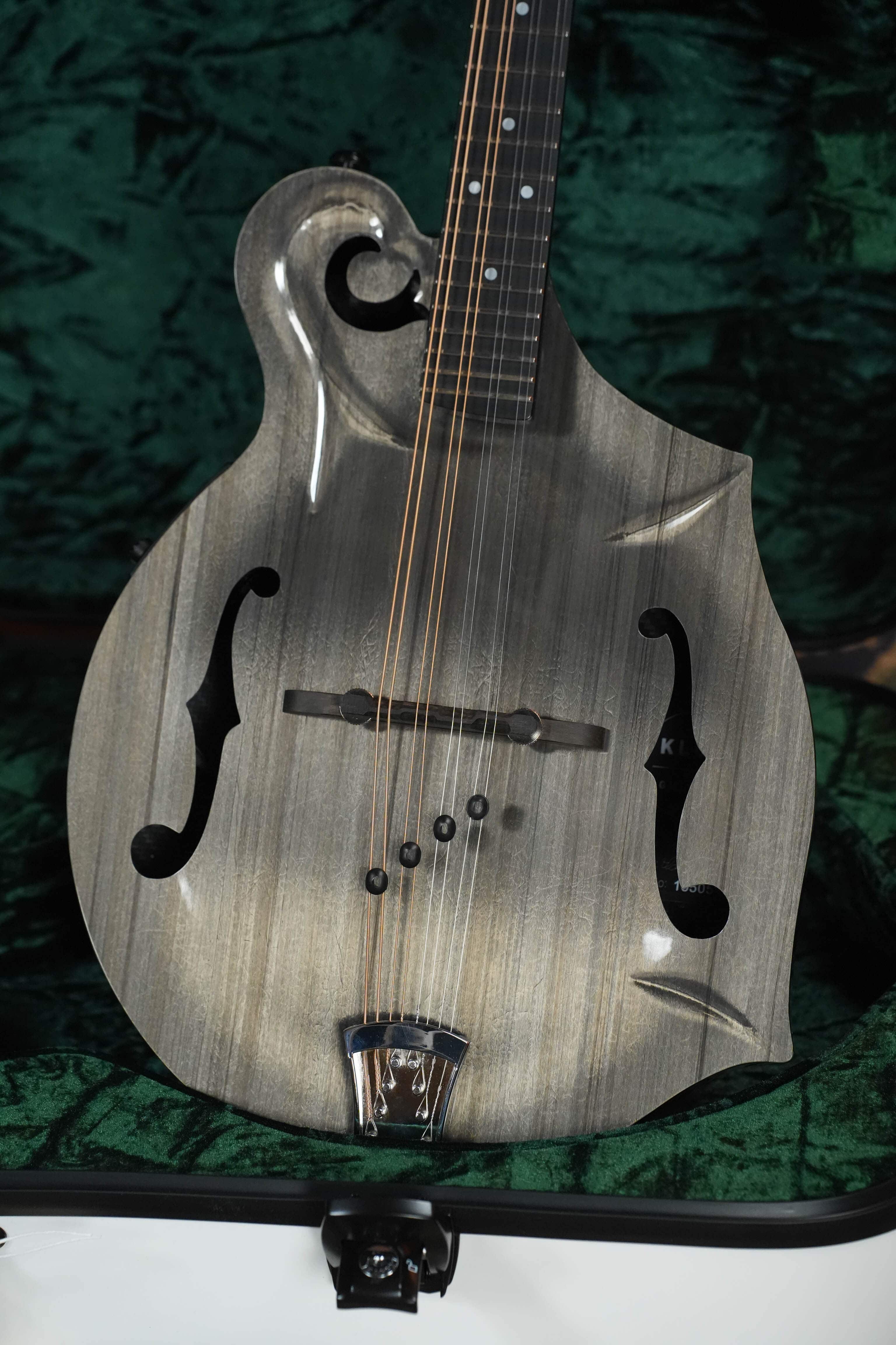 Carbon Timber KLOS F-style mandolin top showing the molded scroll, f-holes and body points