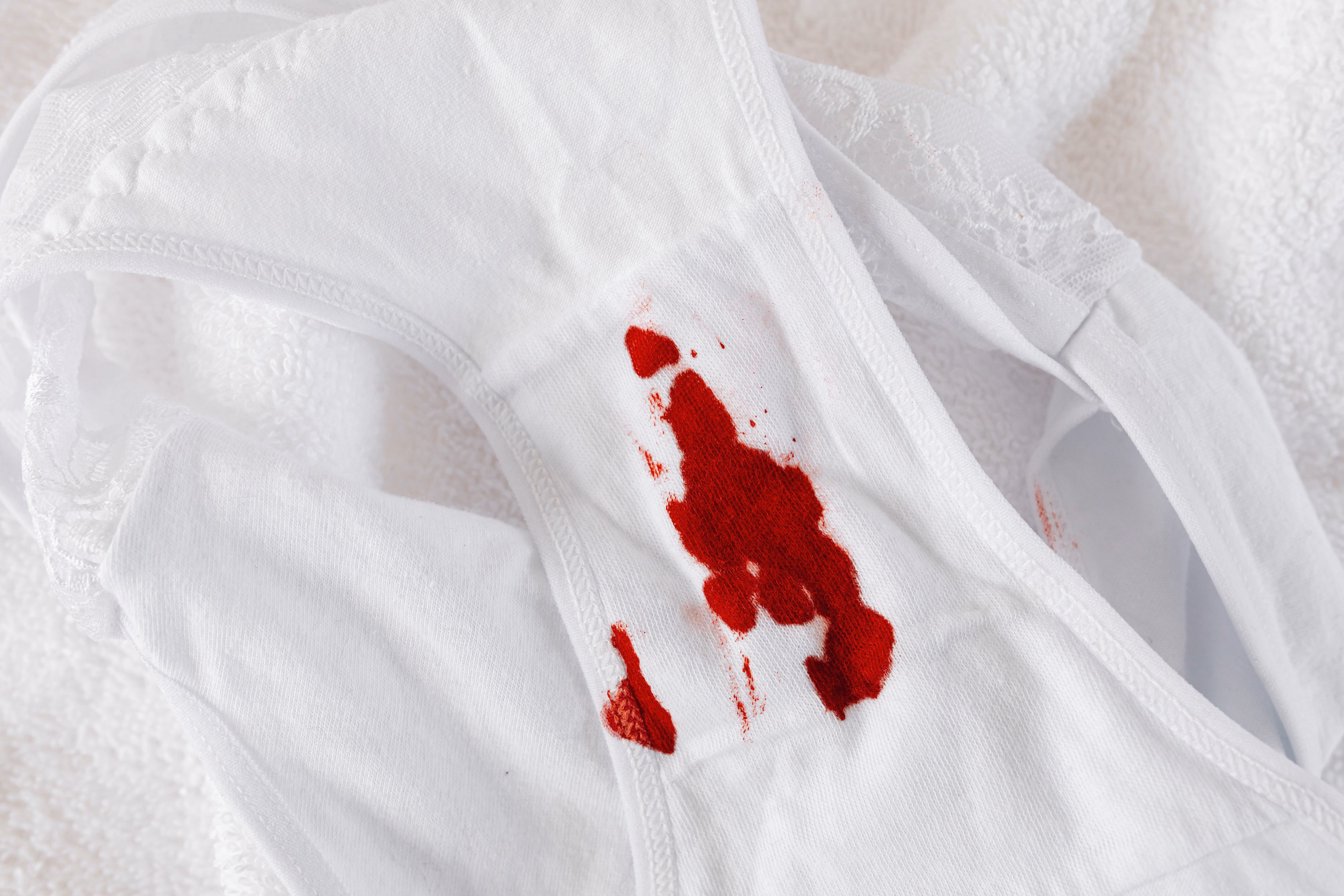 Period blood stain on white underwear. 