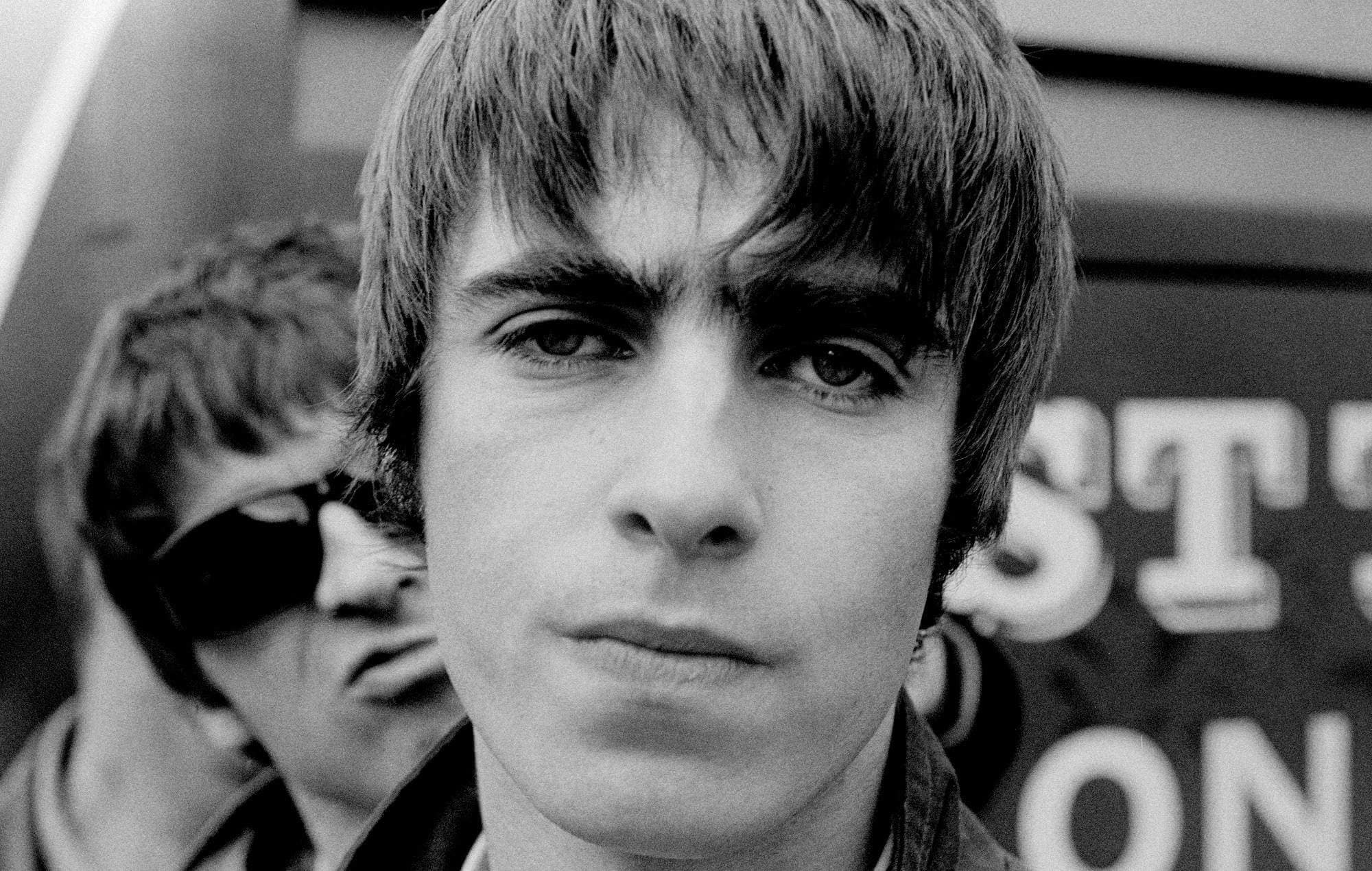Liam Gallagher with Noel Gallagher in Oasis in 1994
