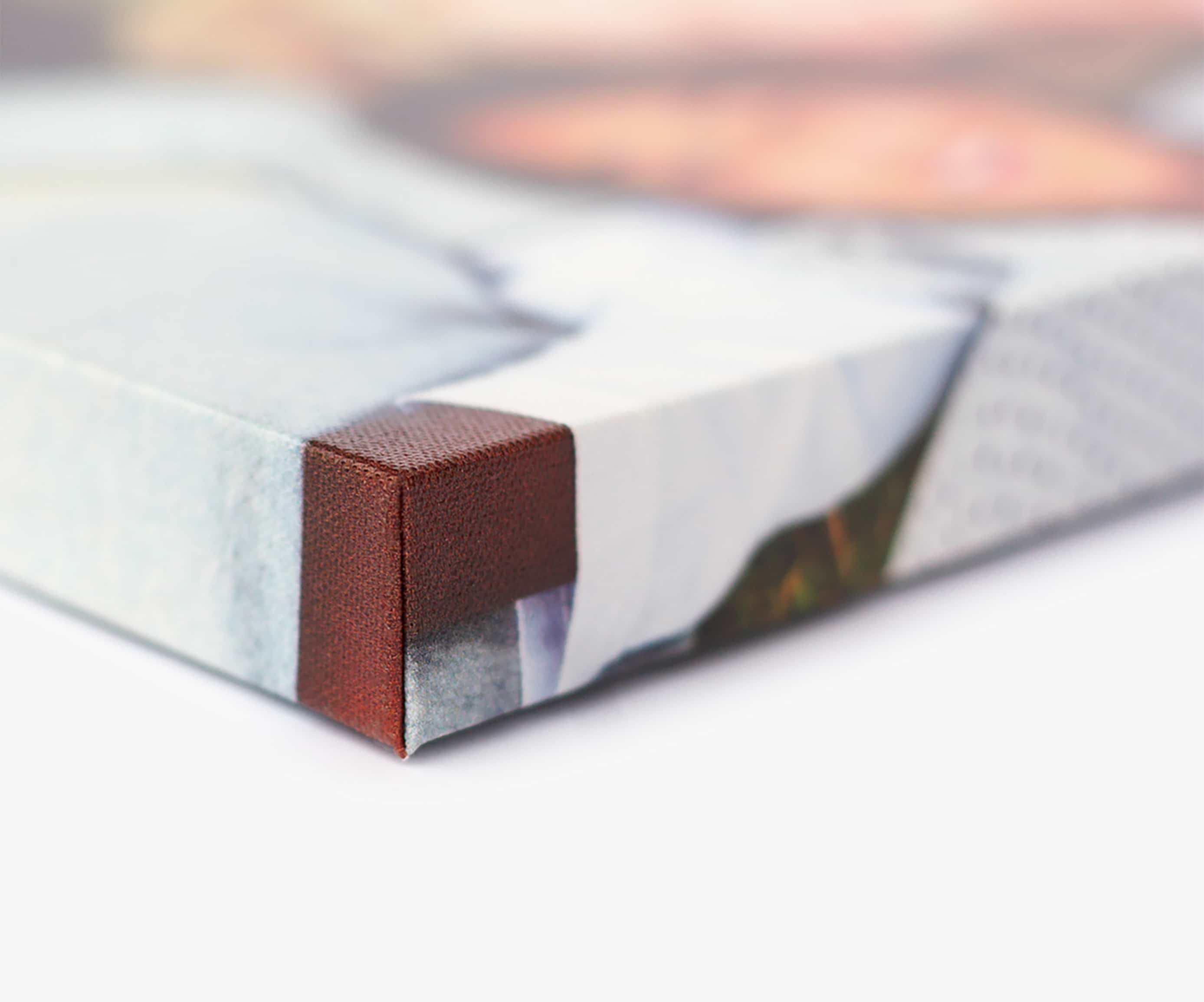 Close-up of a printed canvas wrapped around the corner of its stretcher