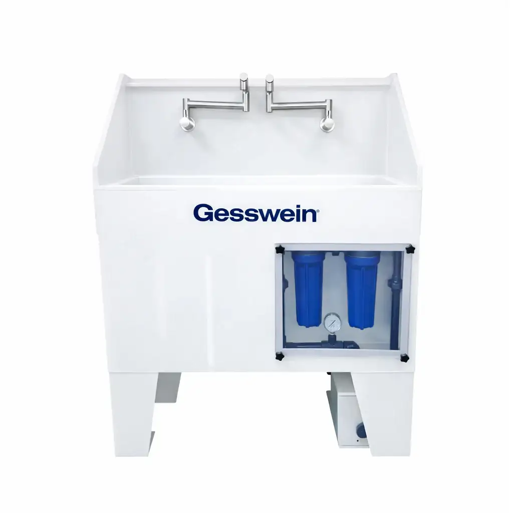 Image of  Gesswein's Precious Metal Recovery Sink. A white sink with silver faucets, showing the blue collection system beneath on a white background.