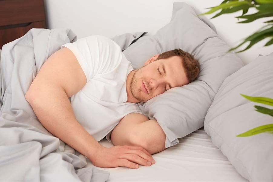 A person sleeping in bedAI-generated content may be incorrect.
