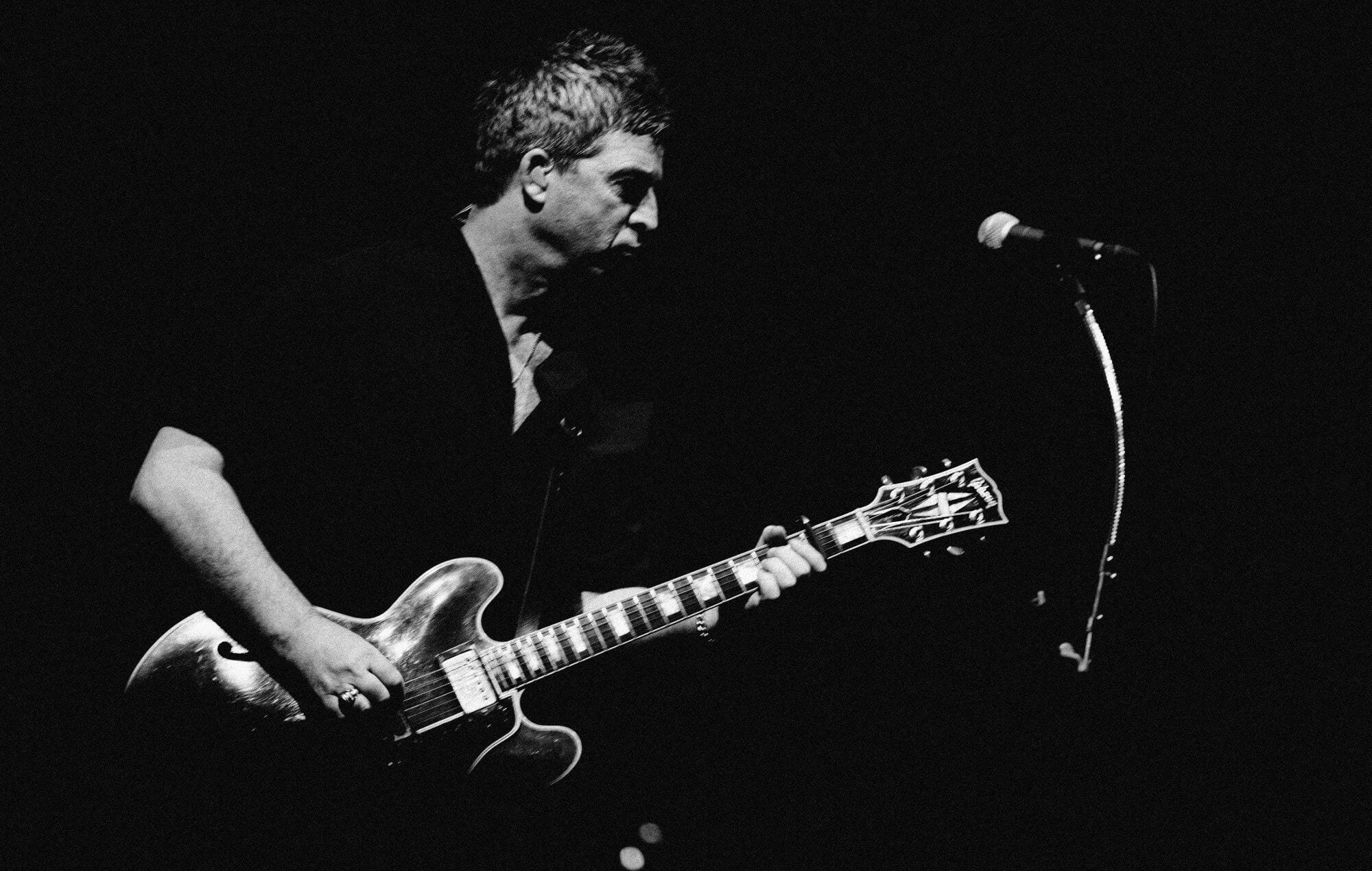 Noel Gallagher, the iconic British songwriter, prepares to collect his BRIT Award.