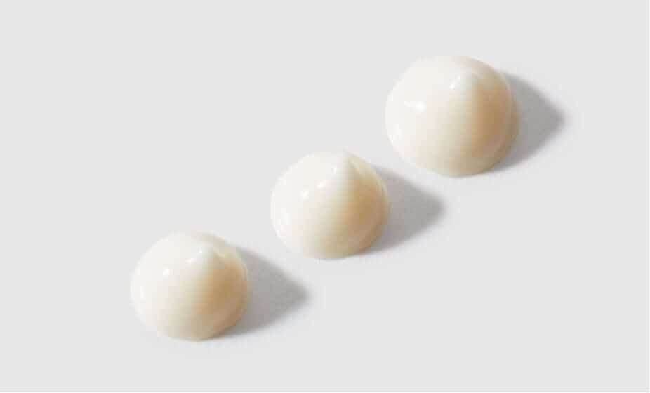 Three dome-shaped applications of Feather Canyon eye cream showing lightweight, cloud-like texture on white background