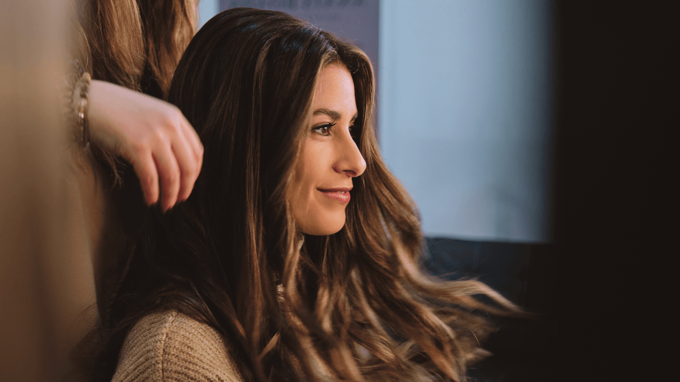 Woman with beautiful long healthy hair showing natural remedies for hair loss