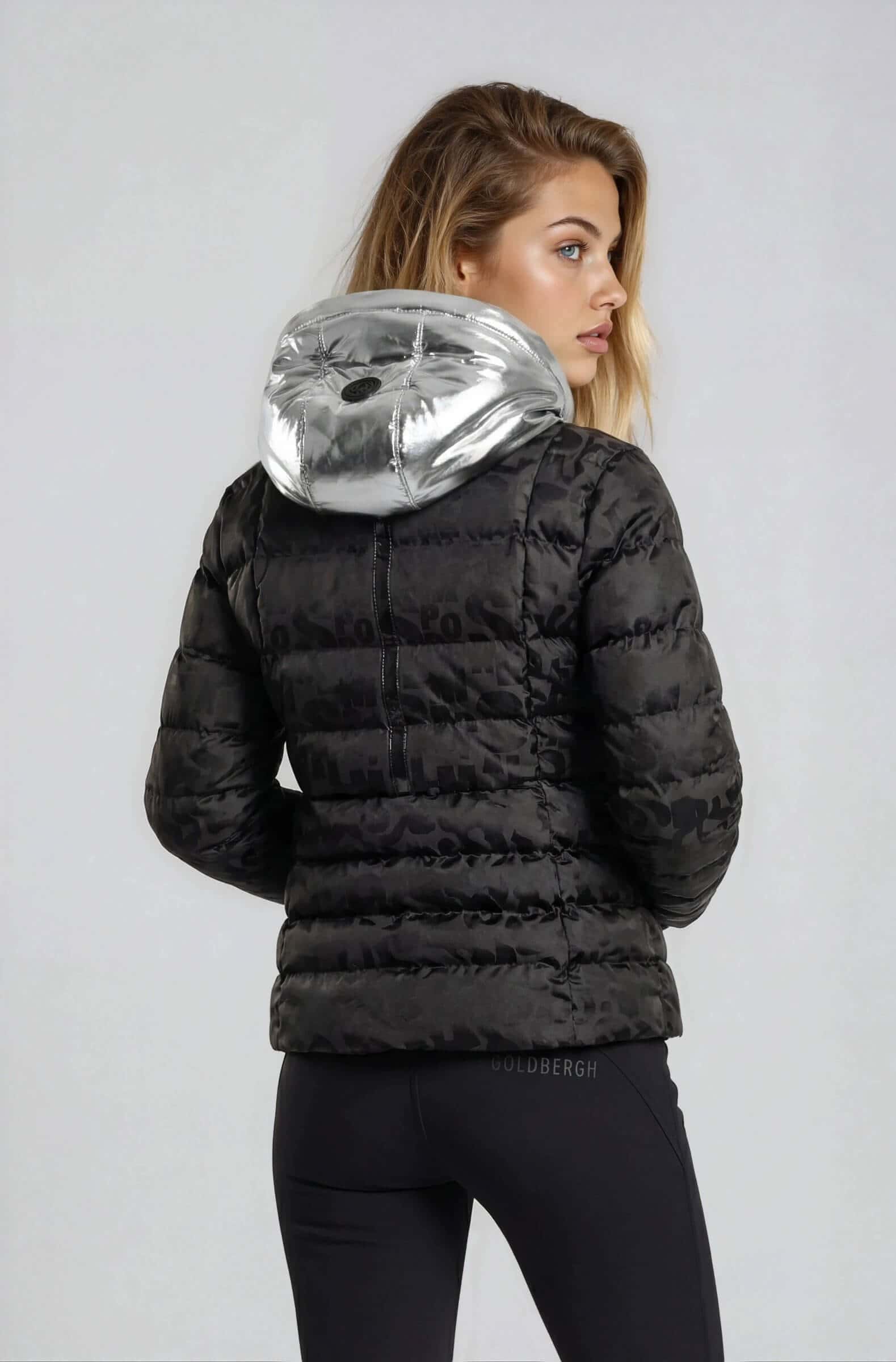 How to shop a ski wear sale and save lots and a lad in black and silver ski jacket