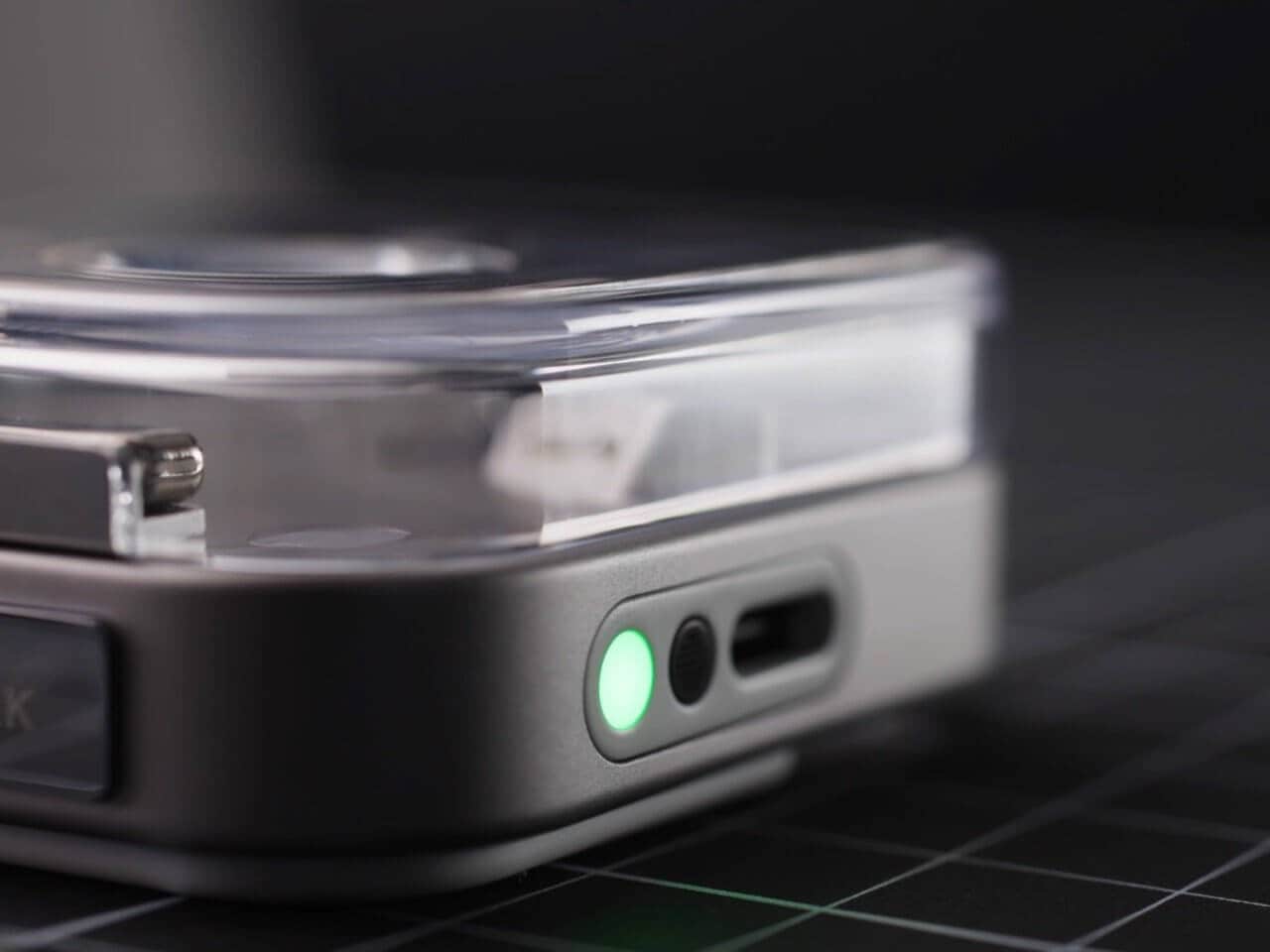 Nothing Ear (3) earbuds in white resting near their transparent charging case