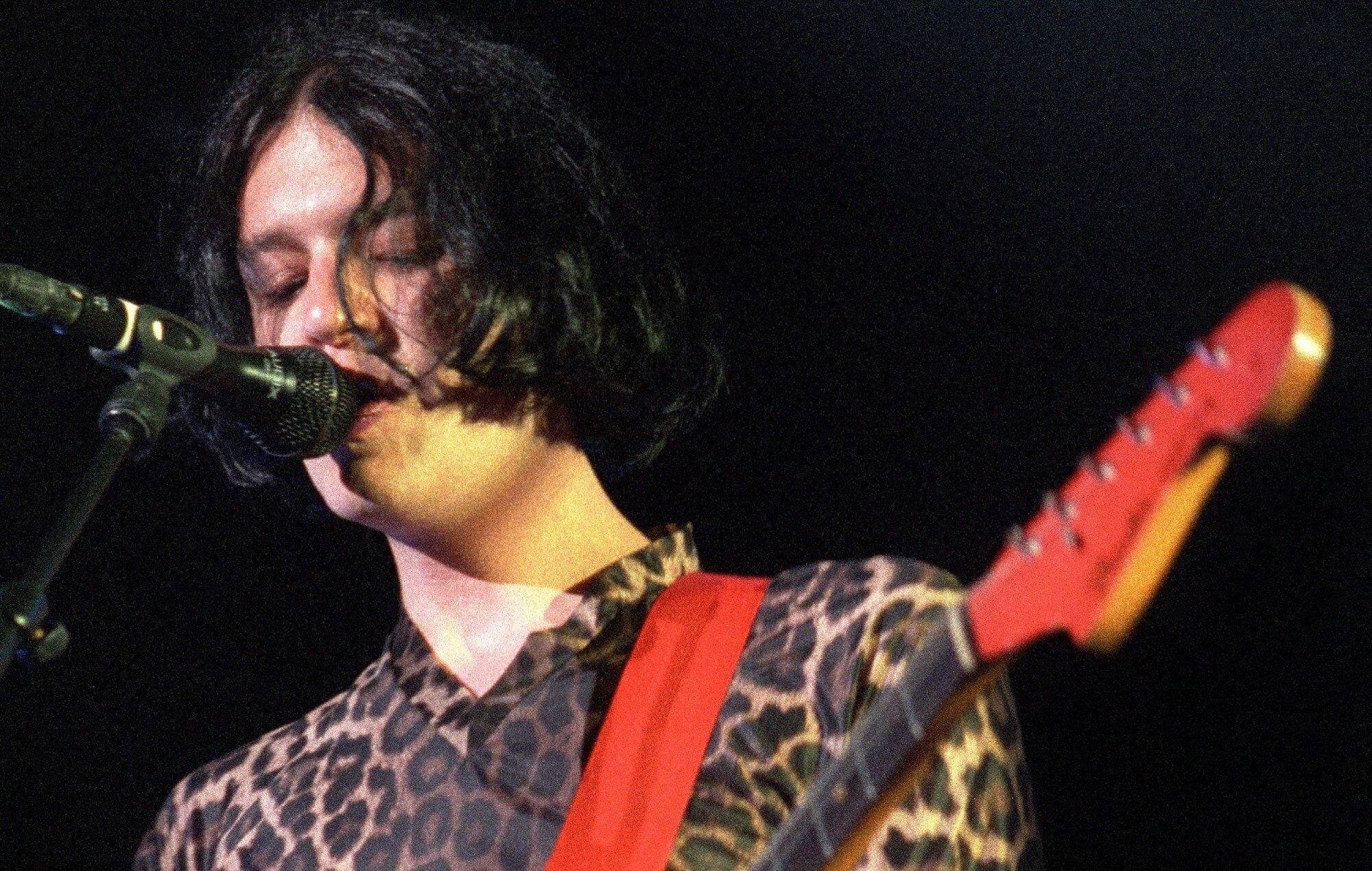 Brian Molko of Placebo performs on stage, supporting David Bowie in July 1996.