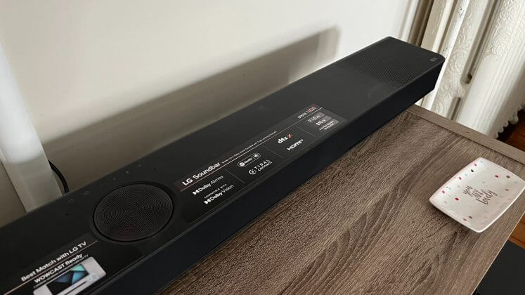 LG S95TR soundbar displayed on a table surface.