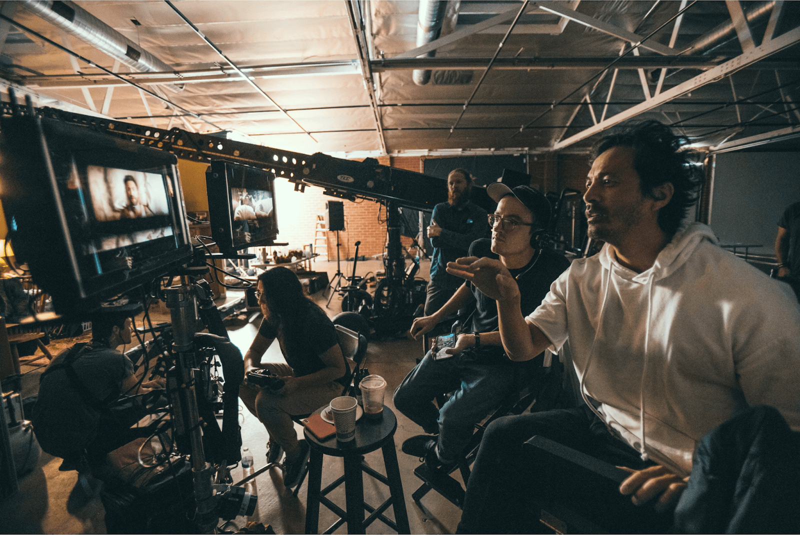 Gabe Harden checking frames with Director Yu Tsai on set for a music video for Jordan McGraw