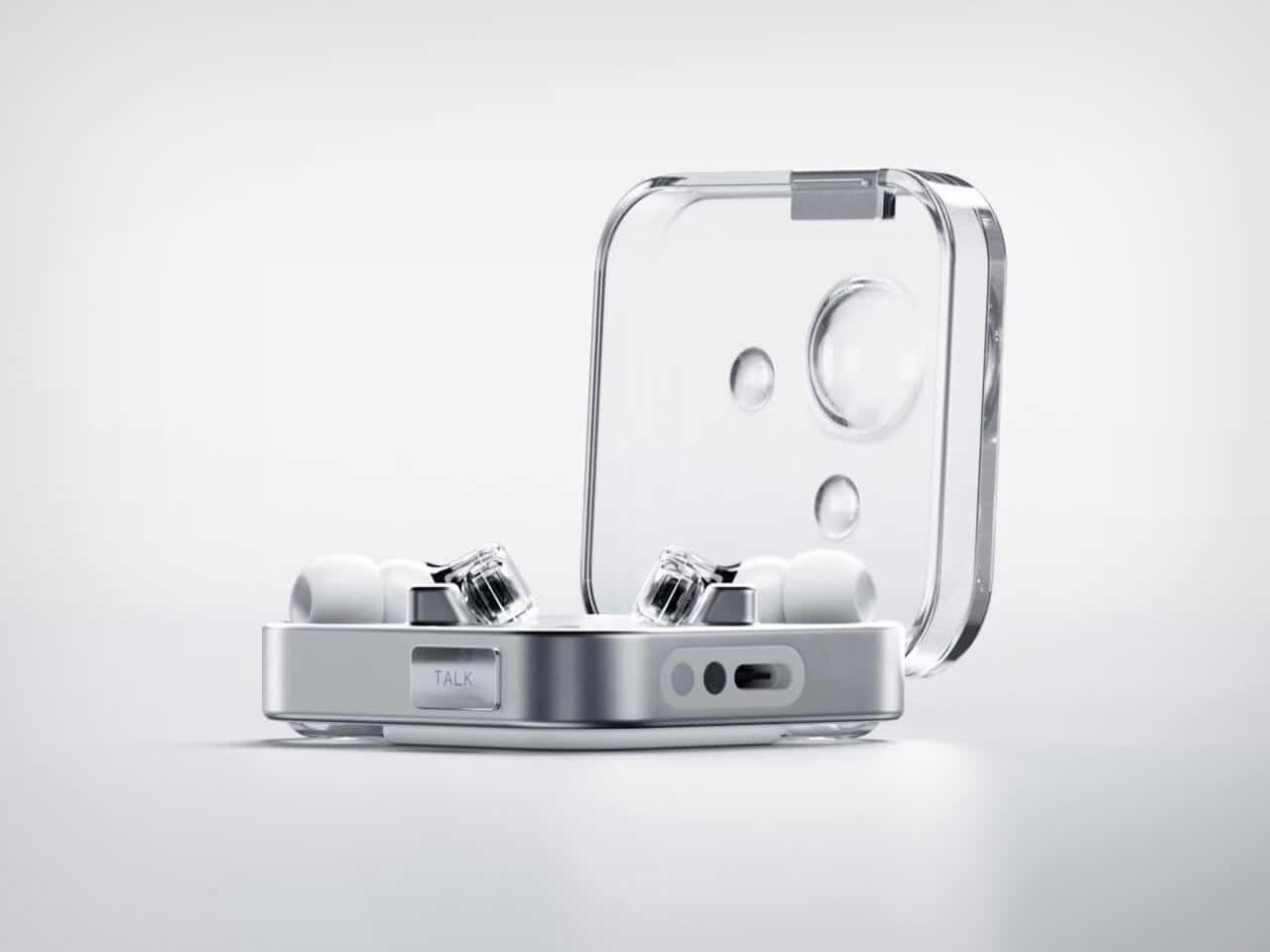 Hand holding Nothing Ear (3) case with a finger on the Talk button