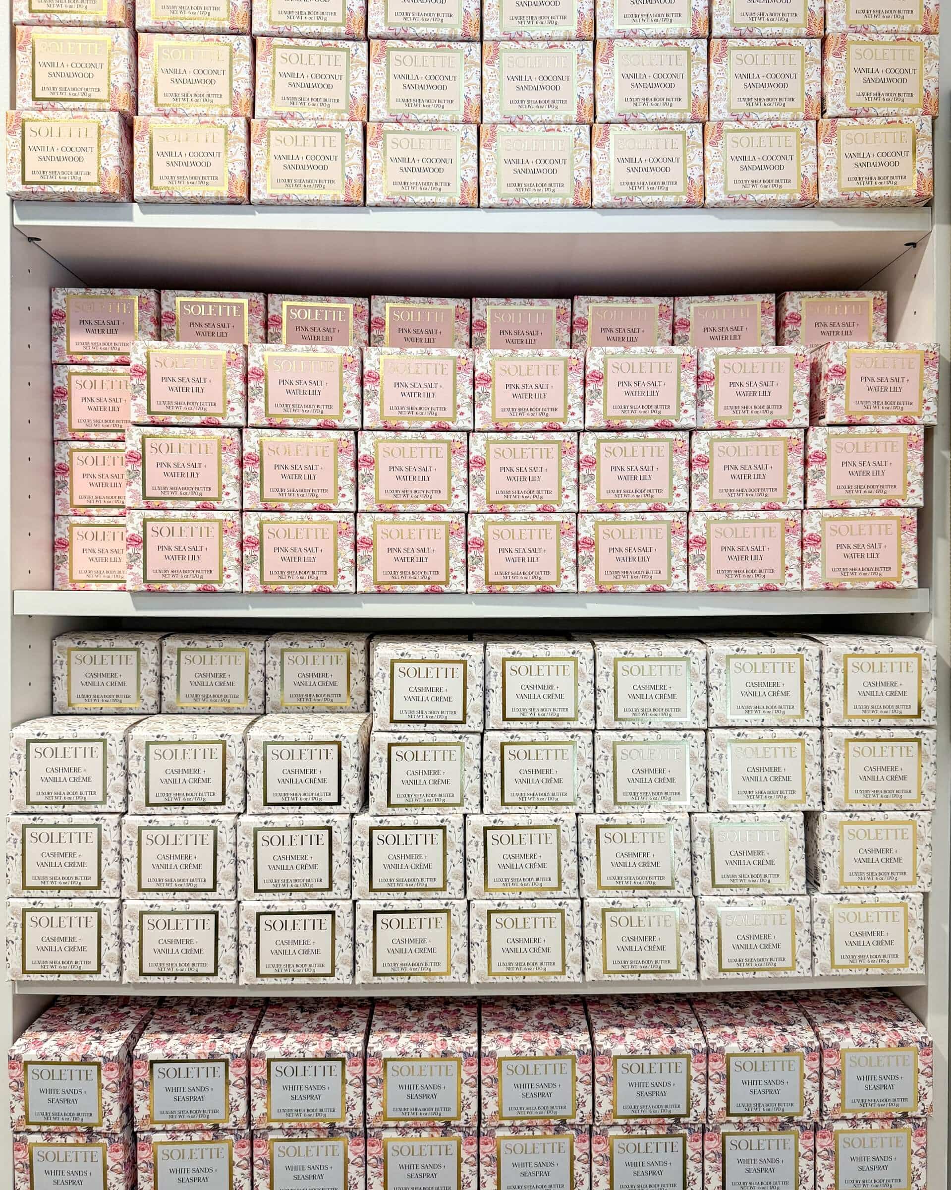 what makes a body butter greasy? a shelf filled with stacked body butter boxes