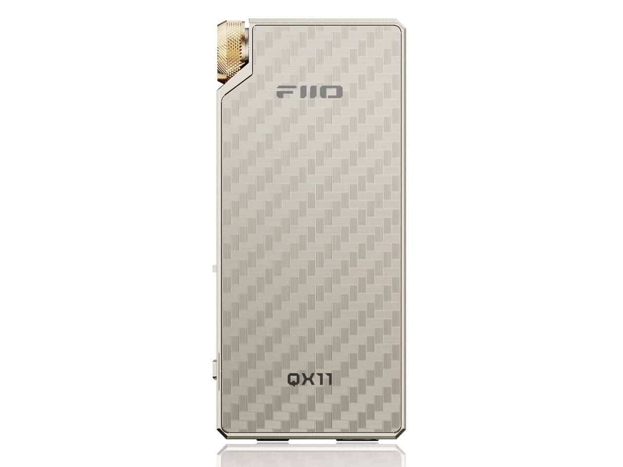 FiiO QX11 portable headphone amplifier positioned for desktop-style listening