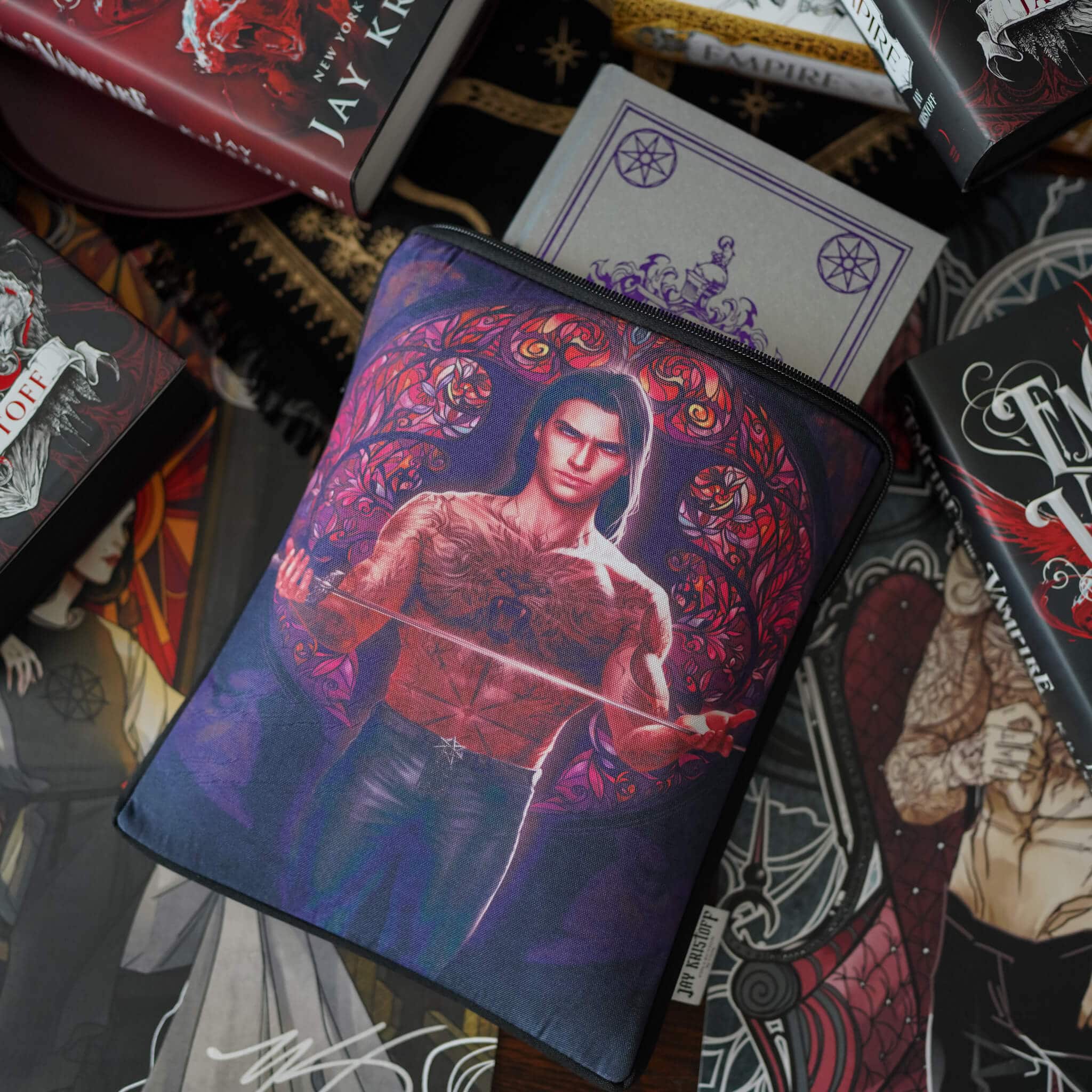 Empire of the Vampire Book Sleeve with an image of Gabriel and Astrid from the Jay Kristoff novel surrounded by stained glass designs.