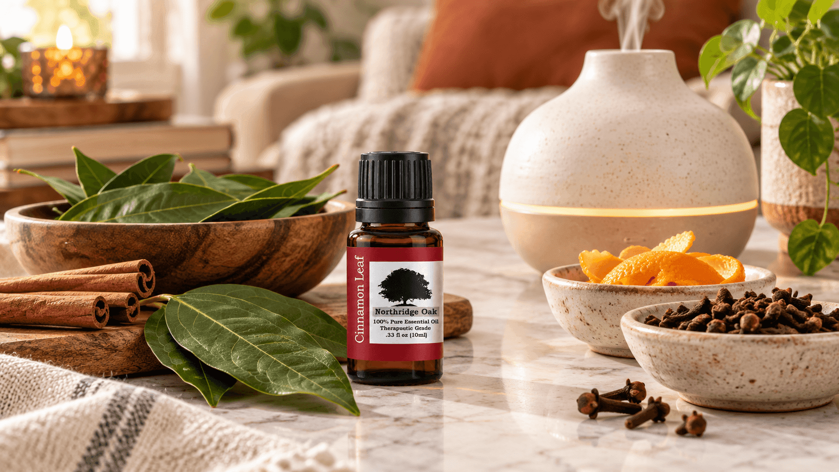Cinnamon Leaf essential oil with a ceramic diffuser, orange peel, clove and cinnamon leaves