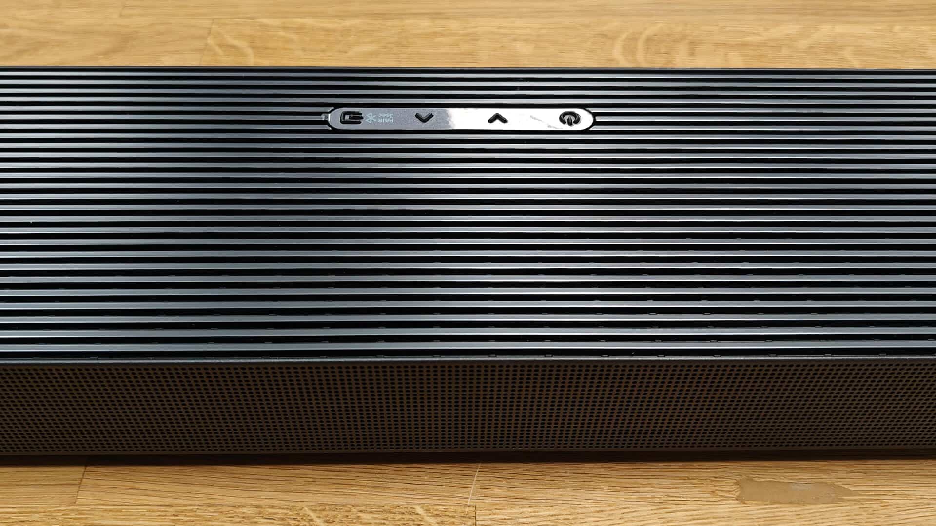 Detail of the soundbar’s upper grille highlighting speaker placement