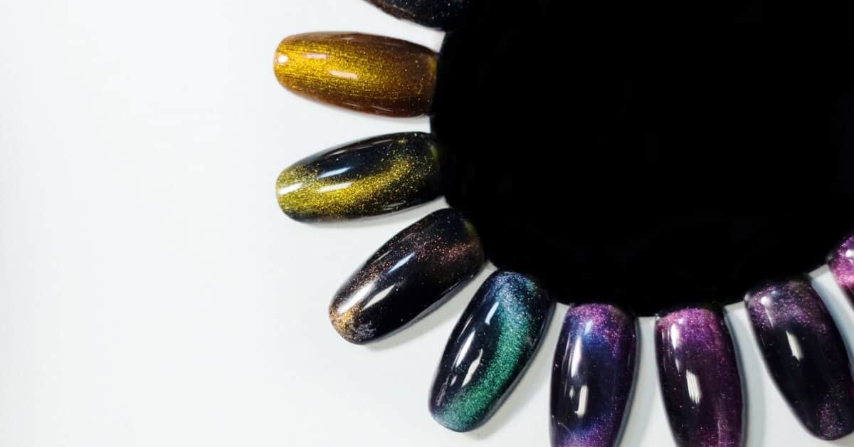 A nail art palette with several display nails attached. The display nails all feature magnetic "cat eye" polish.