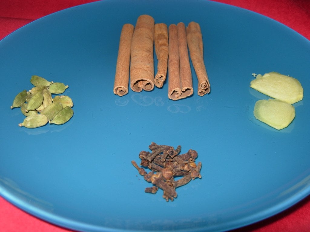 Cinnamon sticks, fresh ginger, cloves and cardamom pods for camel milk tea