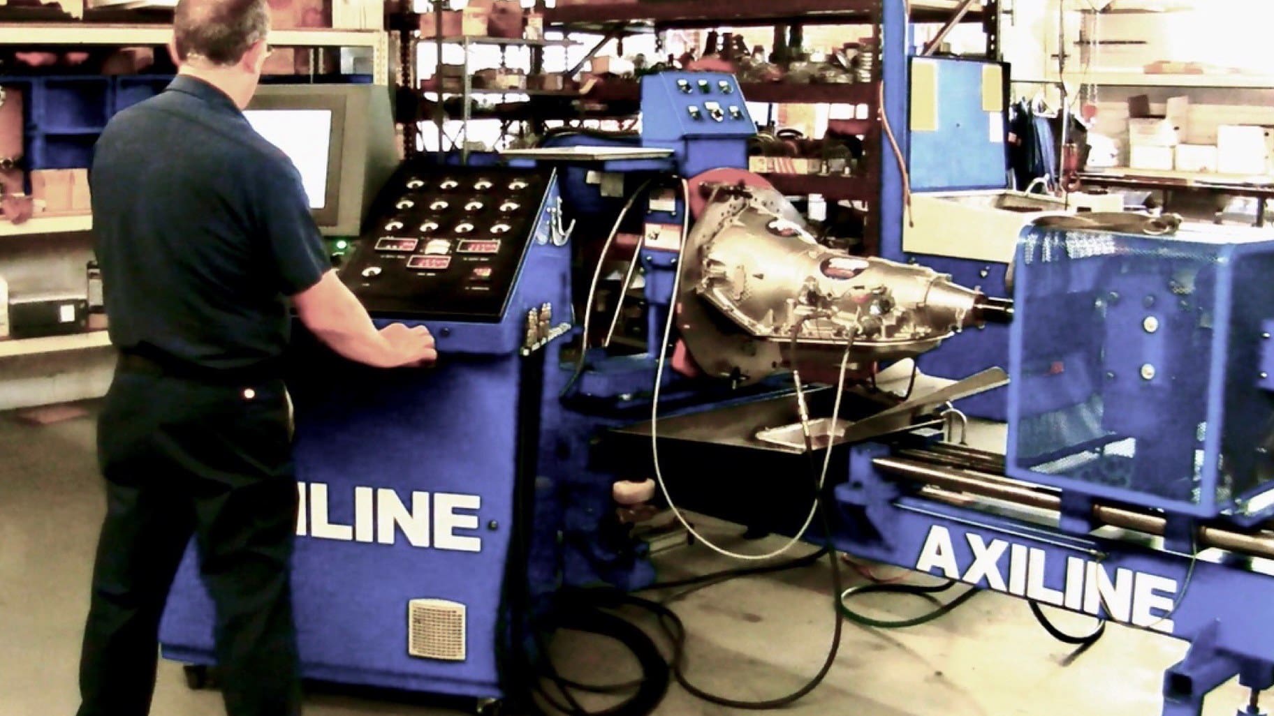 Gearstar technician running a transmission on the Axiline dyno before it ships