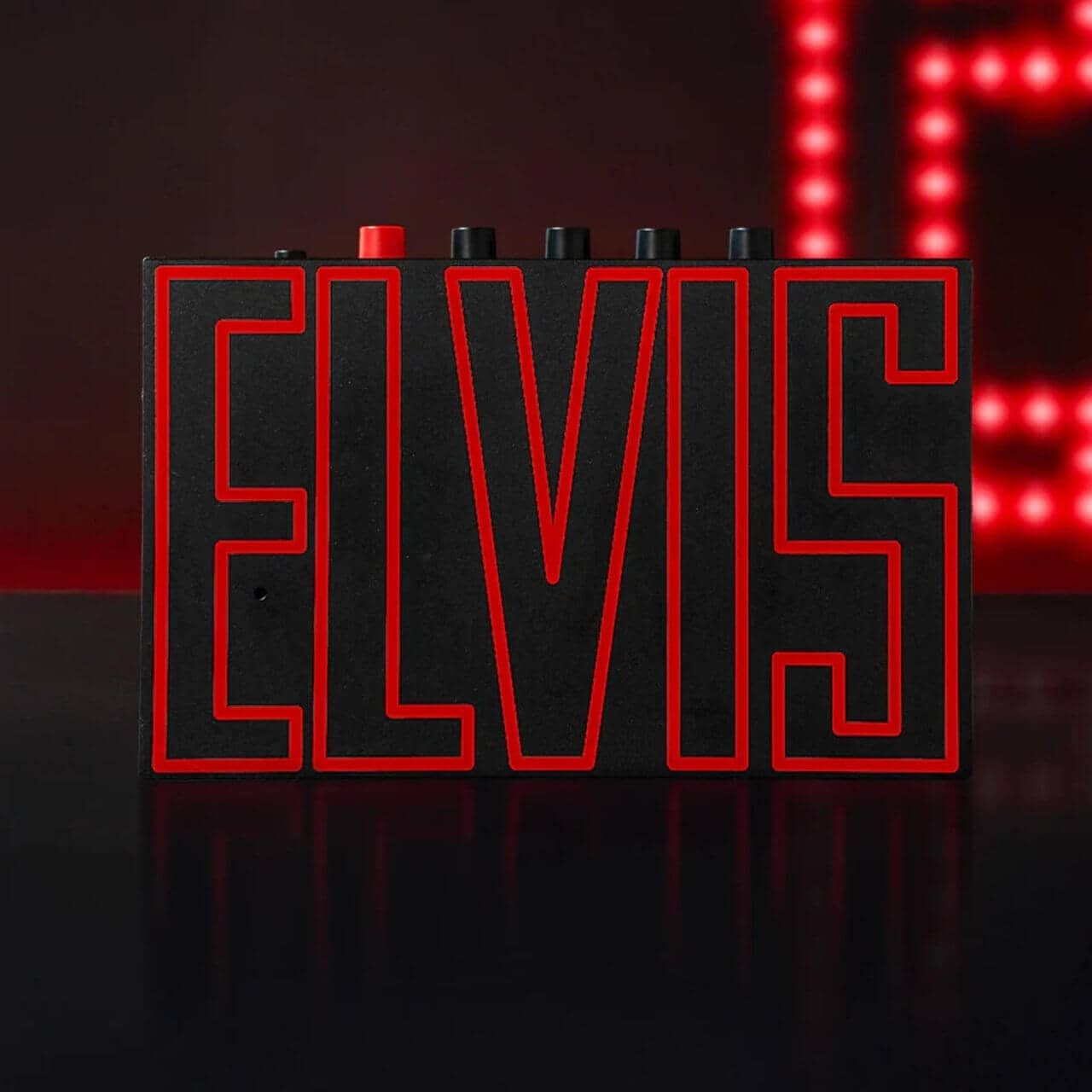 Close-up of the player’s ELVIS nameplate and gold accents