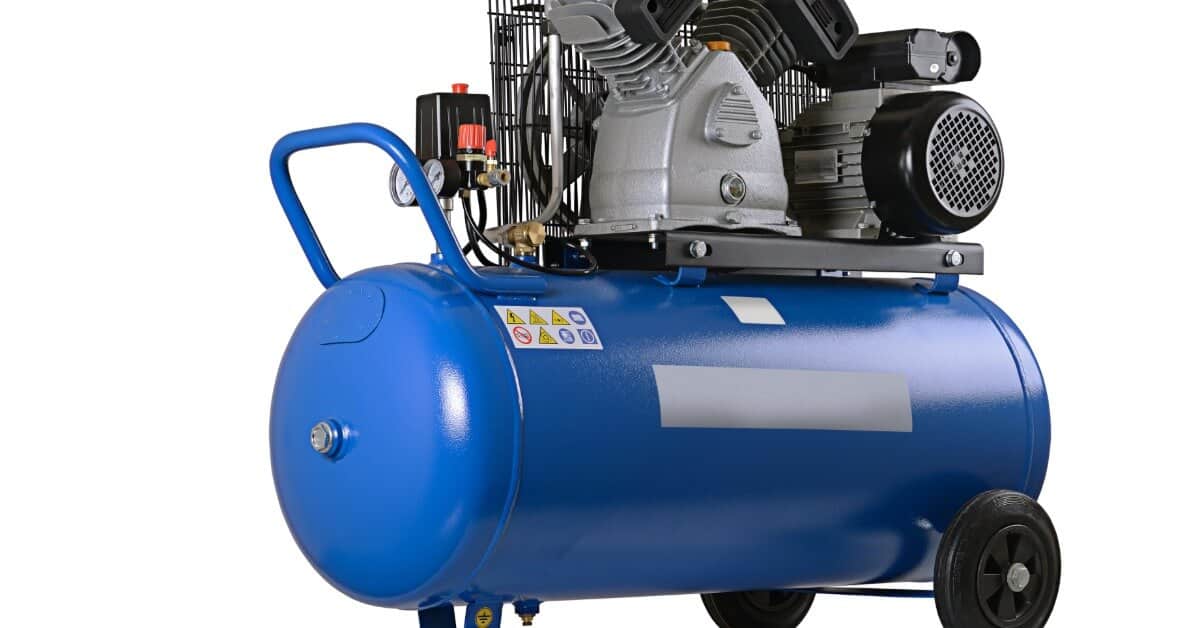 A blue horizontal air compressor with a mounted motor and pump, dual gauges, handle, and wheels on a white background.