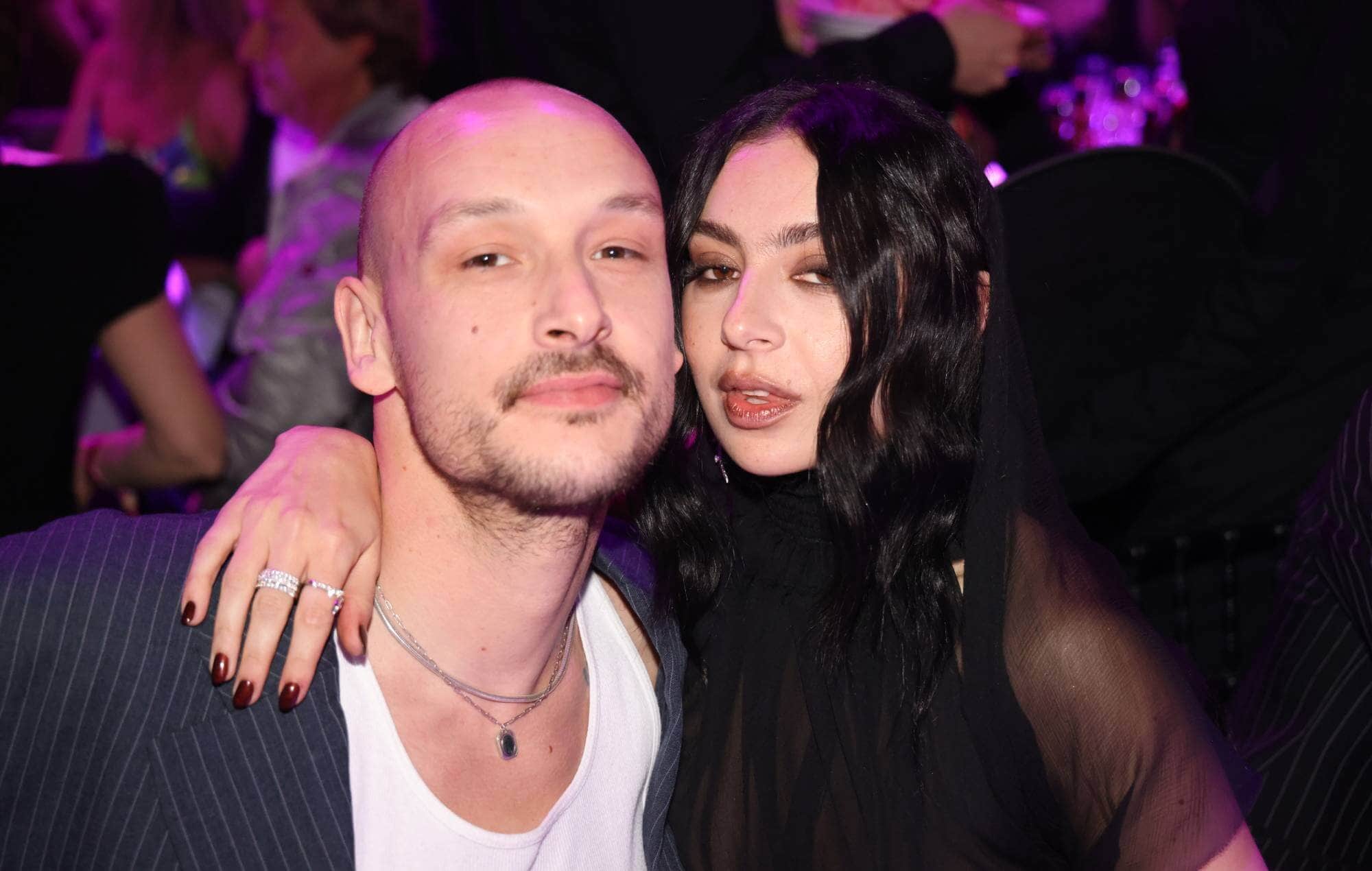 Charli XCX and George Daniel standing outside Hackney Town Hall