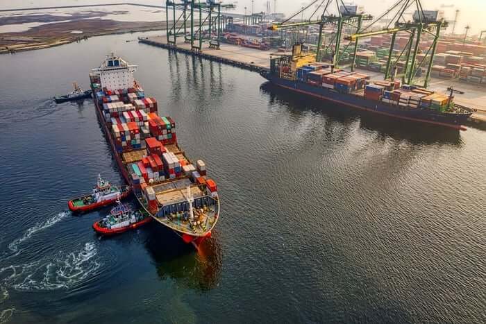 port showing ships and storage tankers