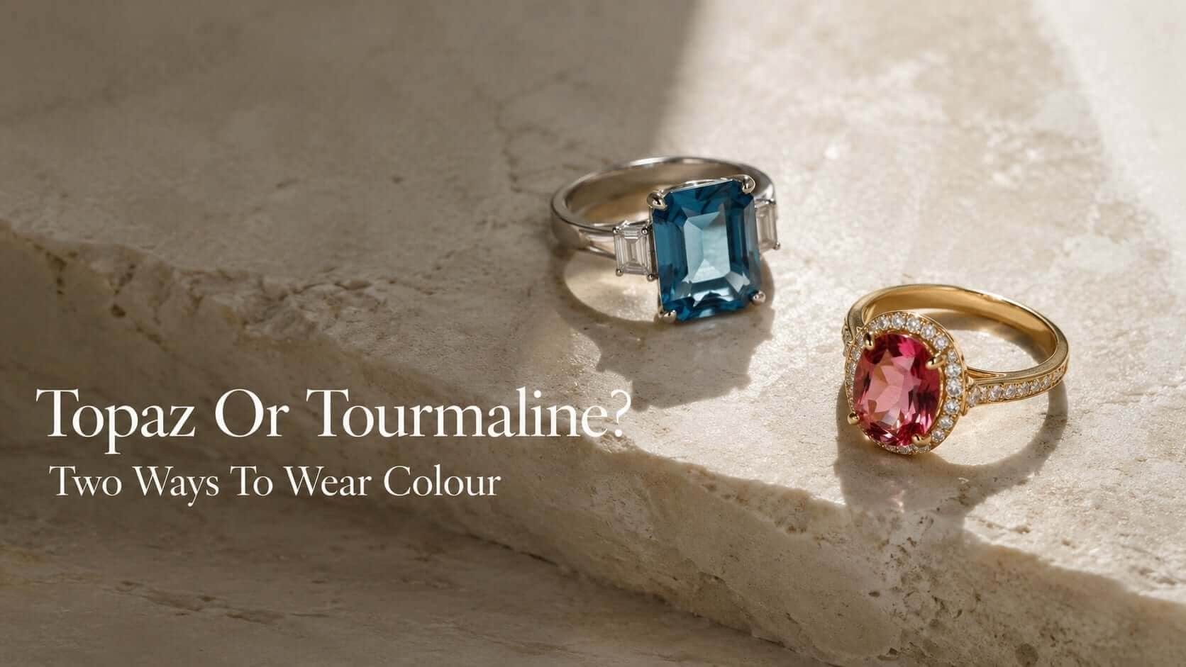 Blue topaz and pink tourmaline fine jewellery arranged on a warm ivory editorial surface