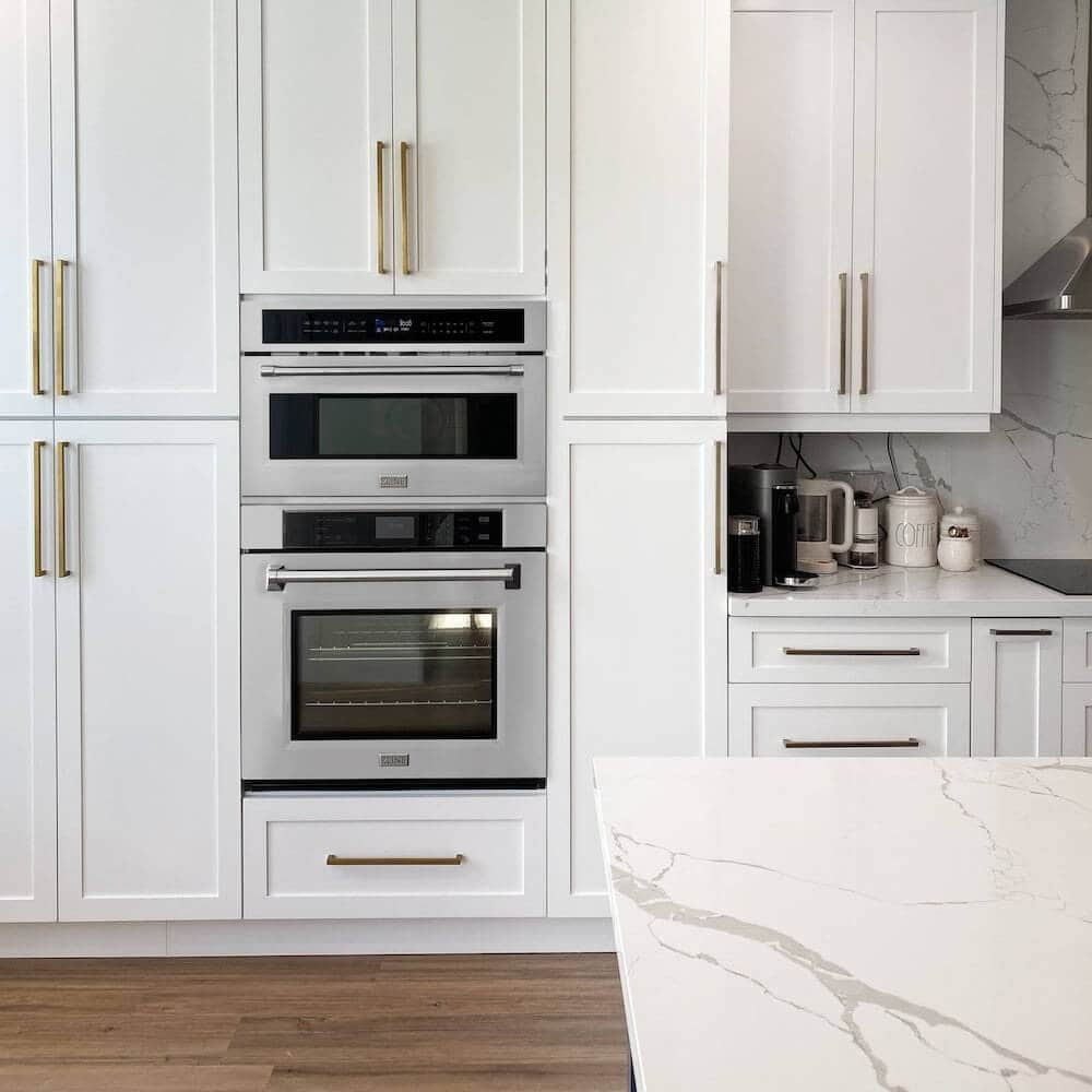 ZLINE 30 in. Professional True Convection Single Wall Oven with Air Fry and Self Clean in Stainless Steel (WAS-30) in a luxury kitchen with matching microwave oven.