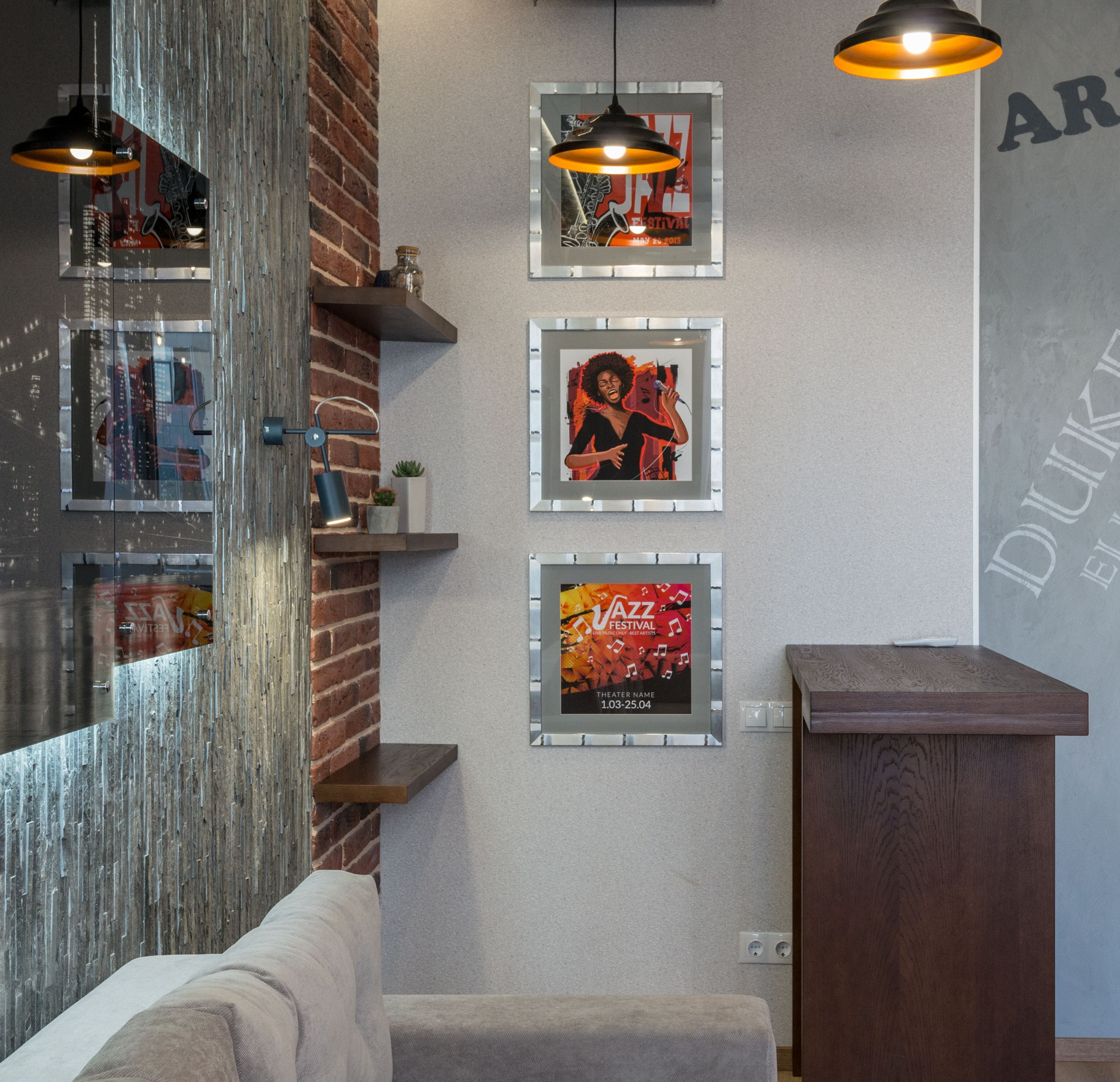 Three framed jazz-themed artworks arranged vertically in a modern living room
