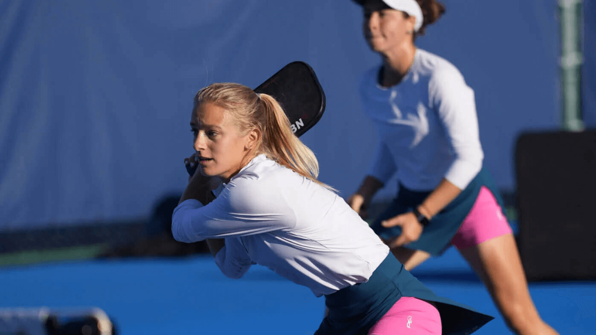 Pickleball player returning a shot