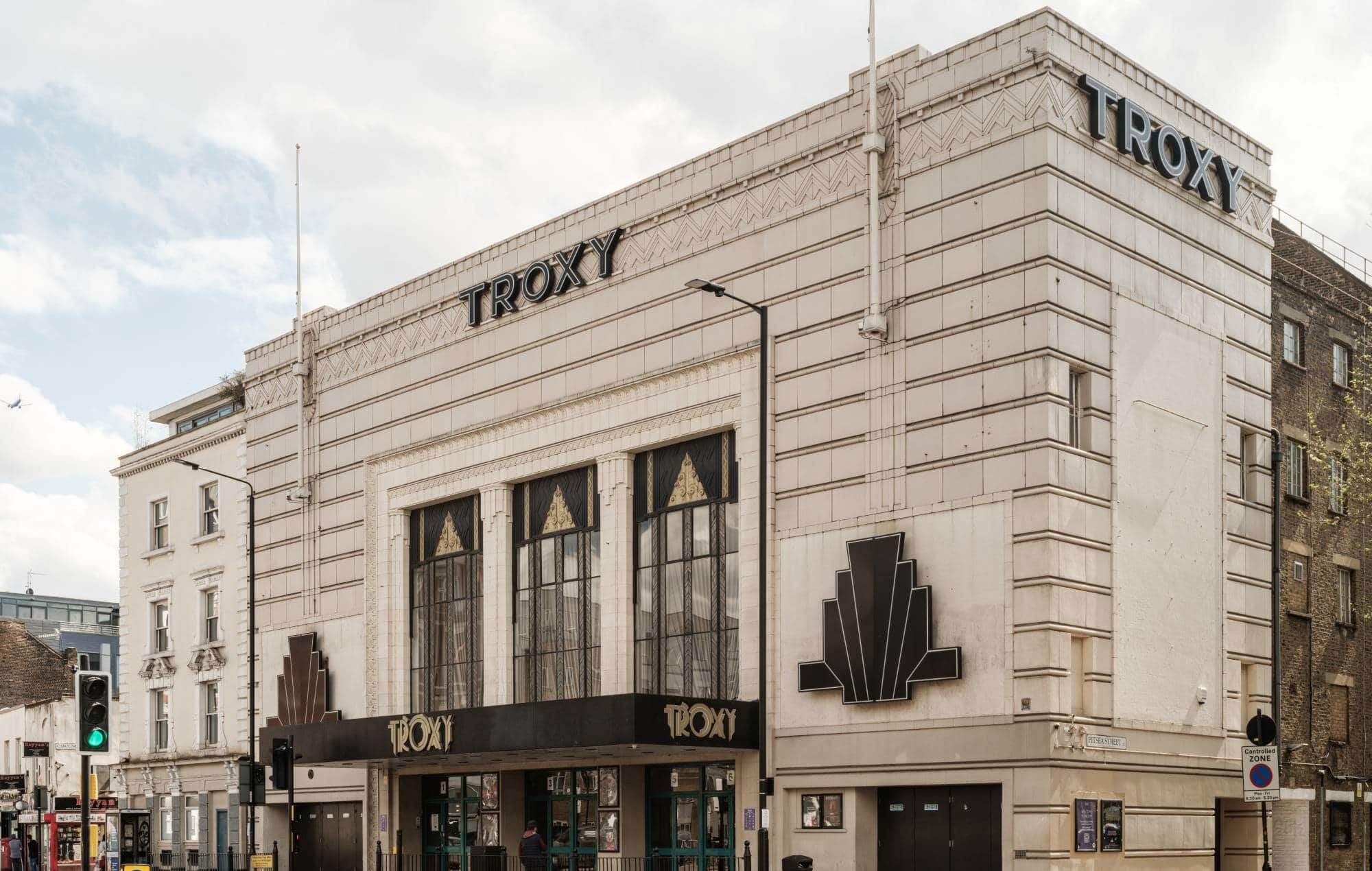 The iconic Art Deco façade of Troxy in East London, a cherished live music venue since 1933.