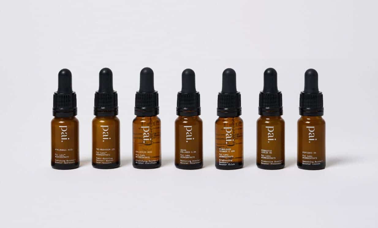 Seven Pai Skincare booster serums in amber glass bottles with black droppers, lined up showing different active ingredients for sensitive skin