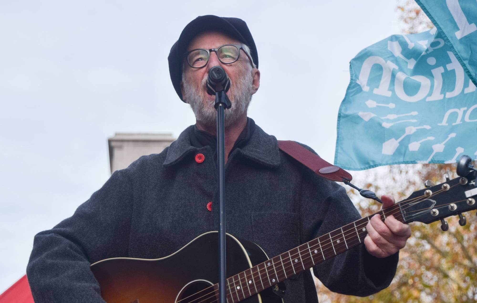 Billy Bragg performing at the London protest