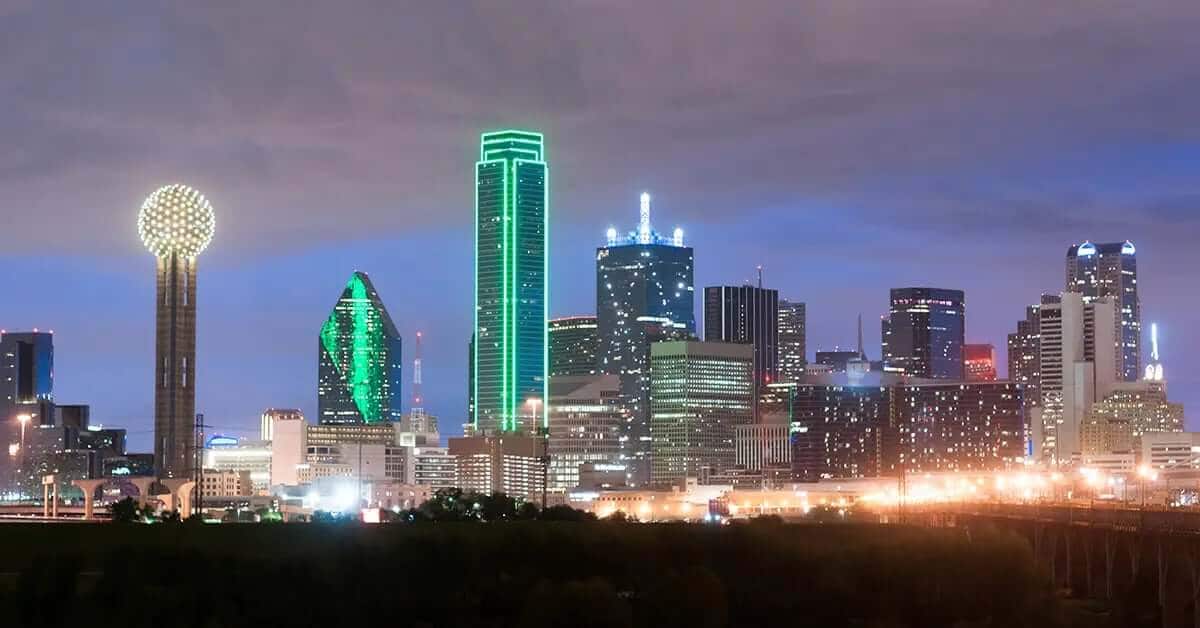 Dallas city skyline at night showing bright lights of the Texas city