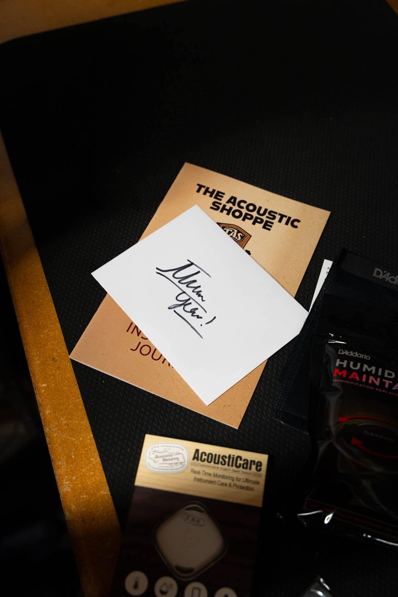 Handwritten thank-you card on a Dread-Not instrument journal with humidity care items