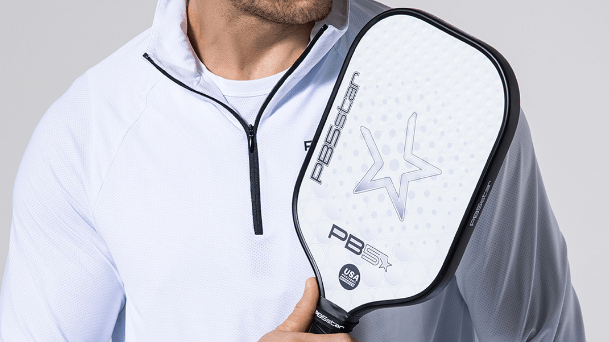 Pickleball player holding a paddle