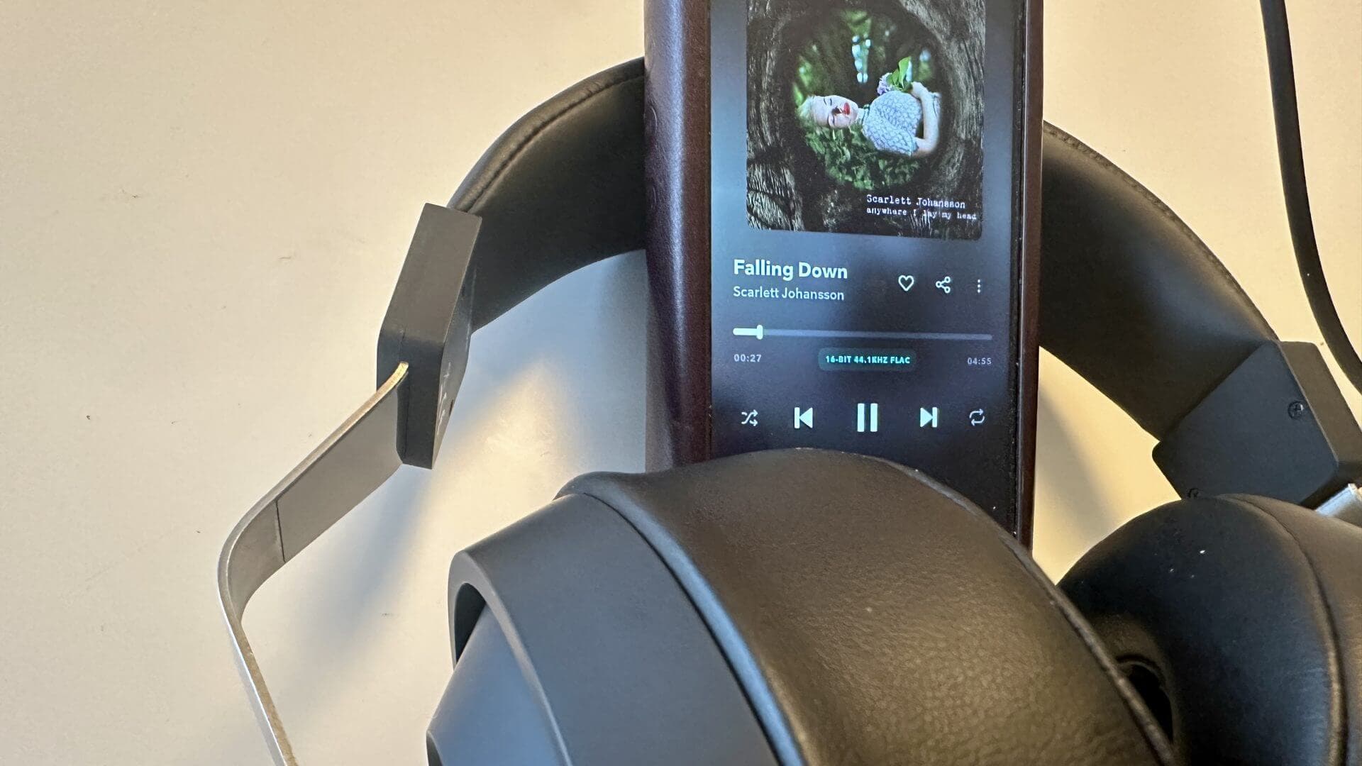 Final Audio DX3000CL headphones resting on wood surface