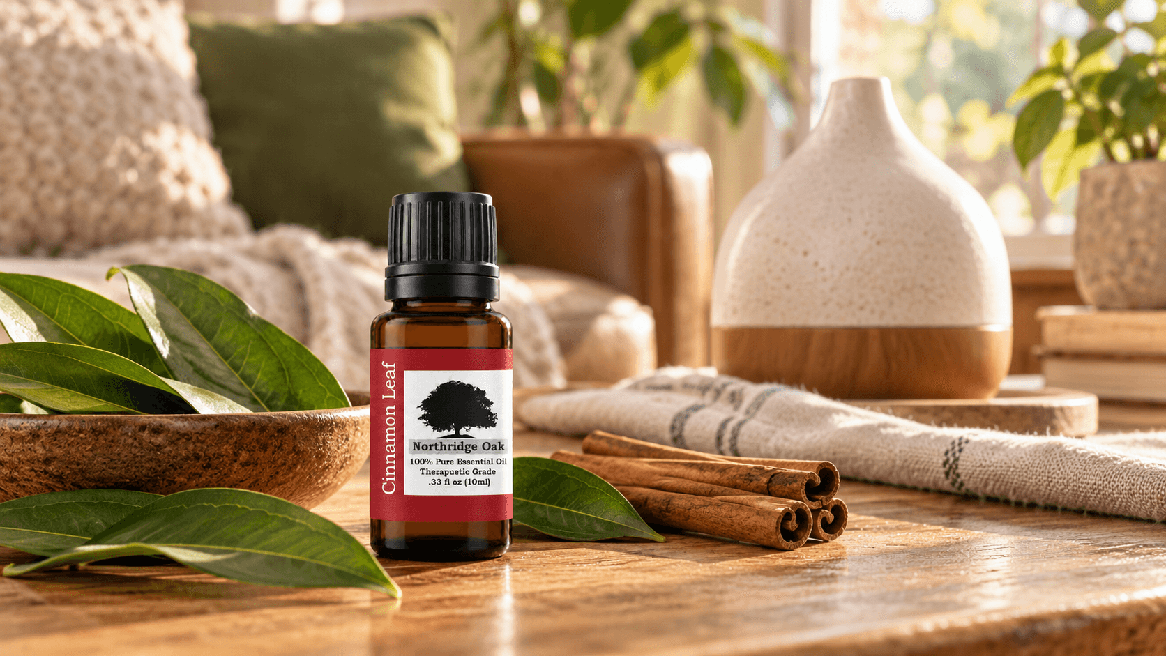 Cinnamon Leaf essential oil with a diffuser, cinnamon leaves and warm home decor